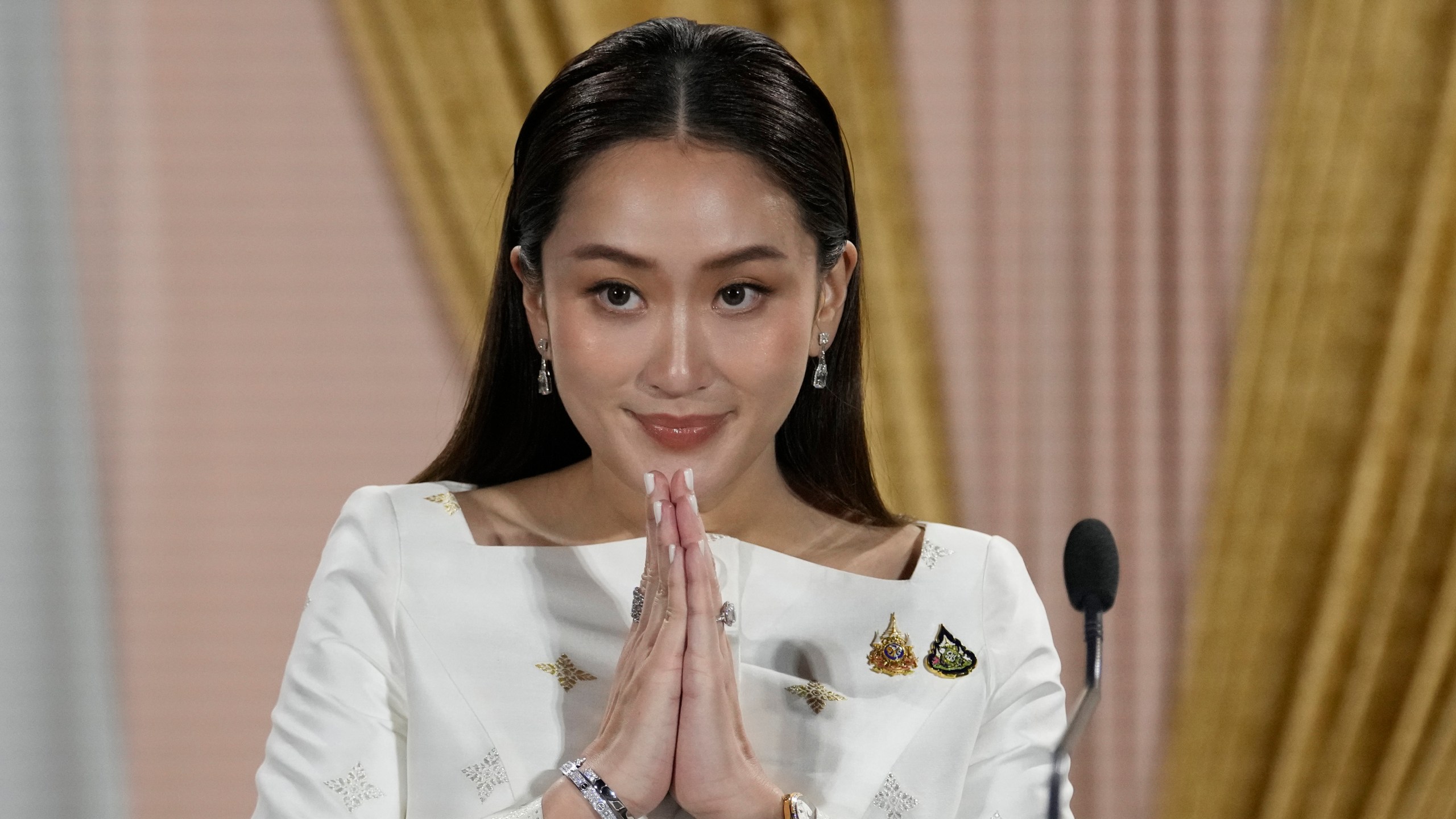 FILE - Thailand's new Prime Minister Paetongtarn Shinawatra talks to media members after receiving a royal letter of endorsement for the post at the Pheu Thai party headquarters in Bangkok, Thailand, on Aug. 18, 2024. (AP Photo/Sakchai Lalit, File)