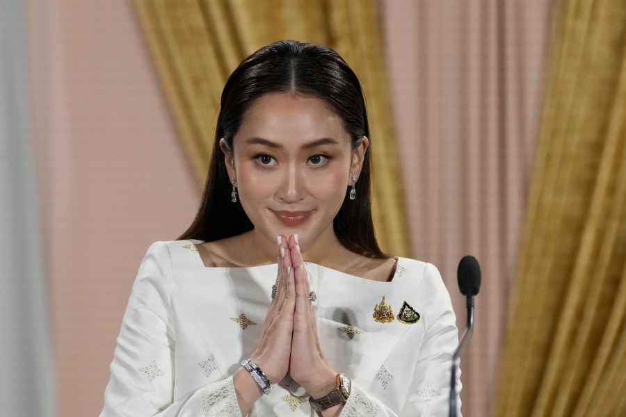 FILE - Thailand's new Prime Minister Paetongtarn Shinawatra talks to media members after receiving a royal letter of endorsement for the post at the Pheu Thai party headquarters in Bangkok, Thailand, on Aug. 18, 2024. (AP Photo/Sakchai Lalit, File)