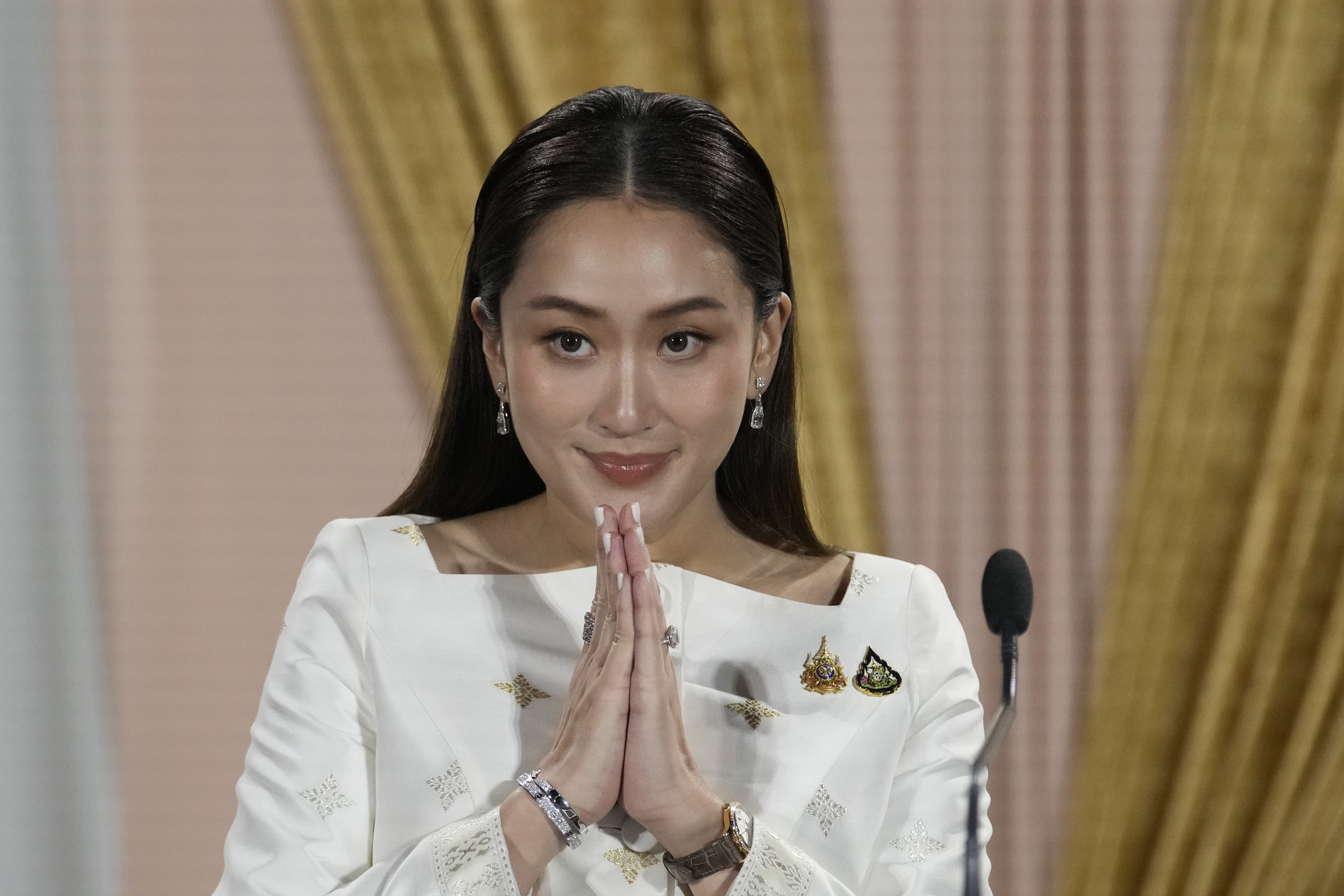 FILE - Thailand's new Prime Minister Paetongtarn Shinawatra talks to media members after receiving a royal letter of endorsement for the post at the Pheu Thai party headquarters in Bangkok, Thailand, on Aug. 18, 2024. (AP Photo/Sakchai Lalit, File)