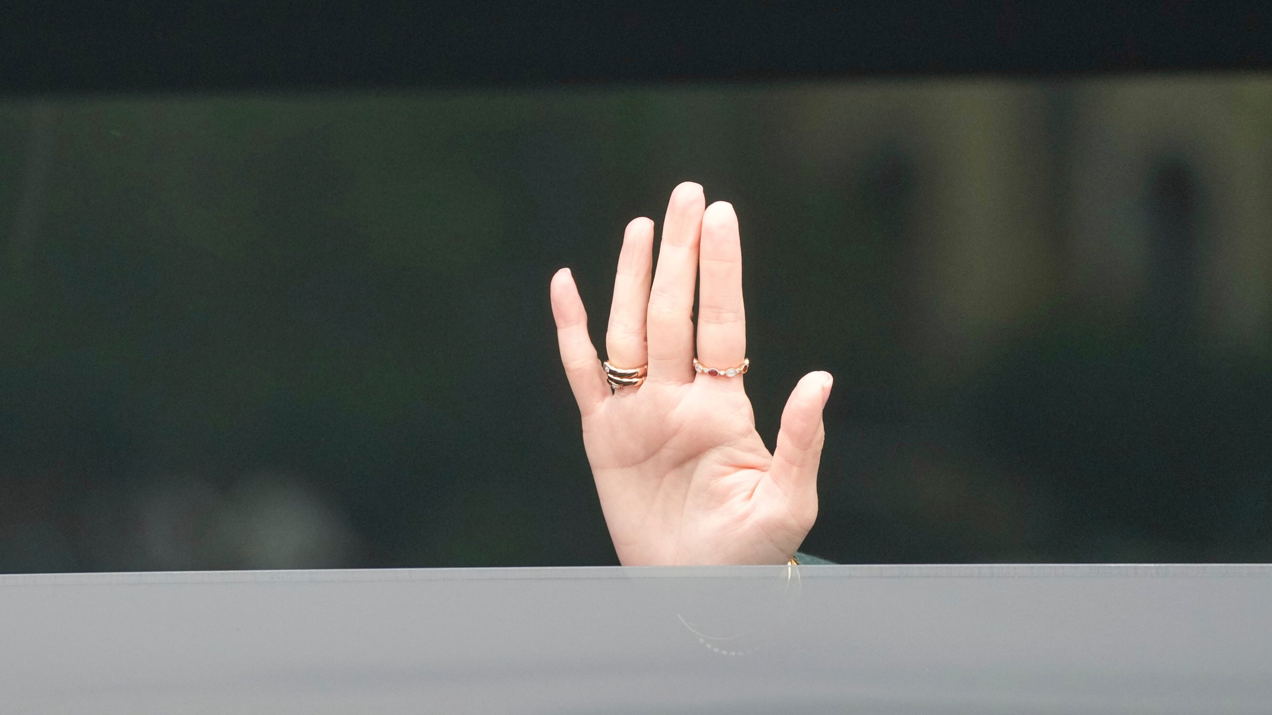 Thailand's Prime Minister Paetongtarn Shinawatra waves as she leaves Government House in Bangkok, Thailand, Tuesday, July 1, 2025, after Thailand's Constitutional Court suspended the prime minister from office pending an investigation over a leaked phone call with a former Cambodian leader. (AP Photo/Sakchai Lalit)