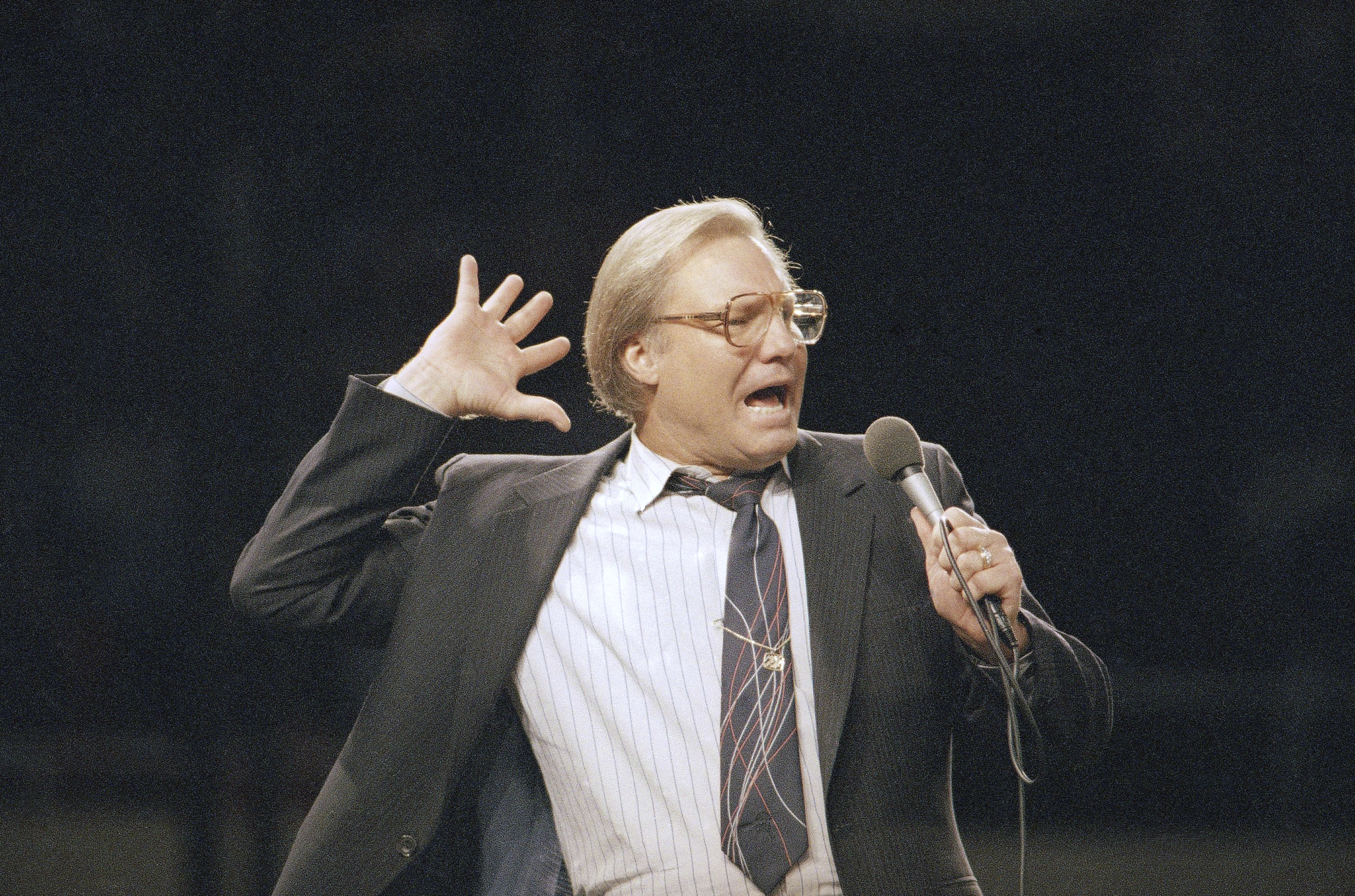 FILE - The Rev. Jimmy Swaggart gestures as he preaches the Gospel to the nearly 14,000 faithful who attended his Los Angeles Crusade in the Sports Arena, Sunday, March 29, 1987. (AP Photo/Mark Avery, file)