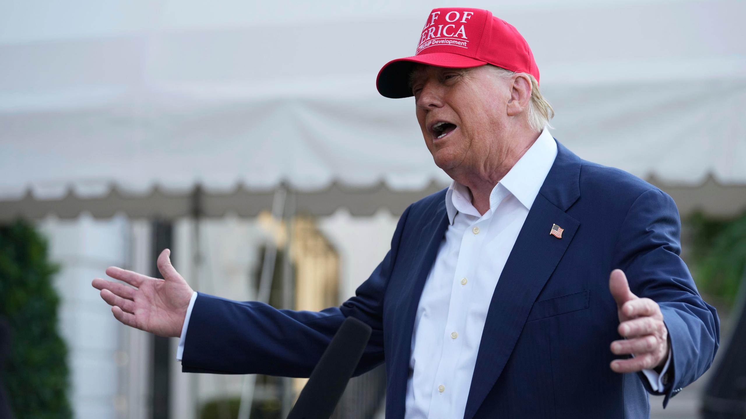 President Donald Trump speaks to the media before walking across the South Lawn of the White House to board Marine One en route to Joint Base Andrews, Md., and on to Florida, Tuesday, July 1, 2025, in Washington. (AP Photo/Mark Schiefelbein)