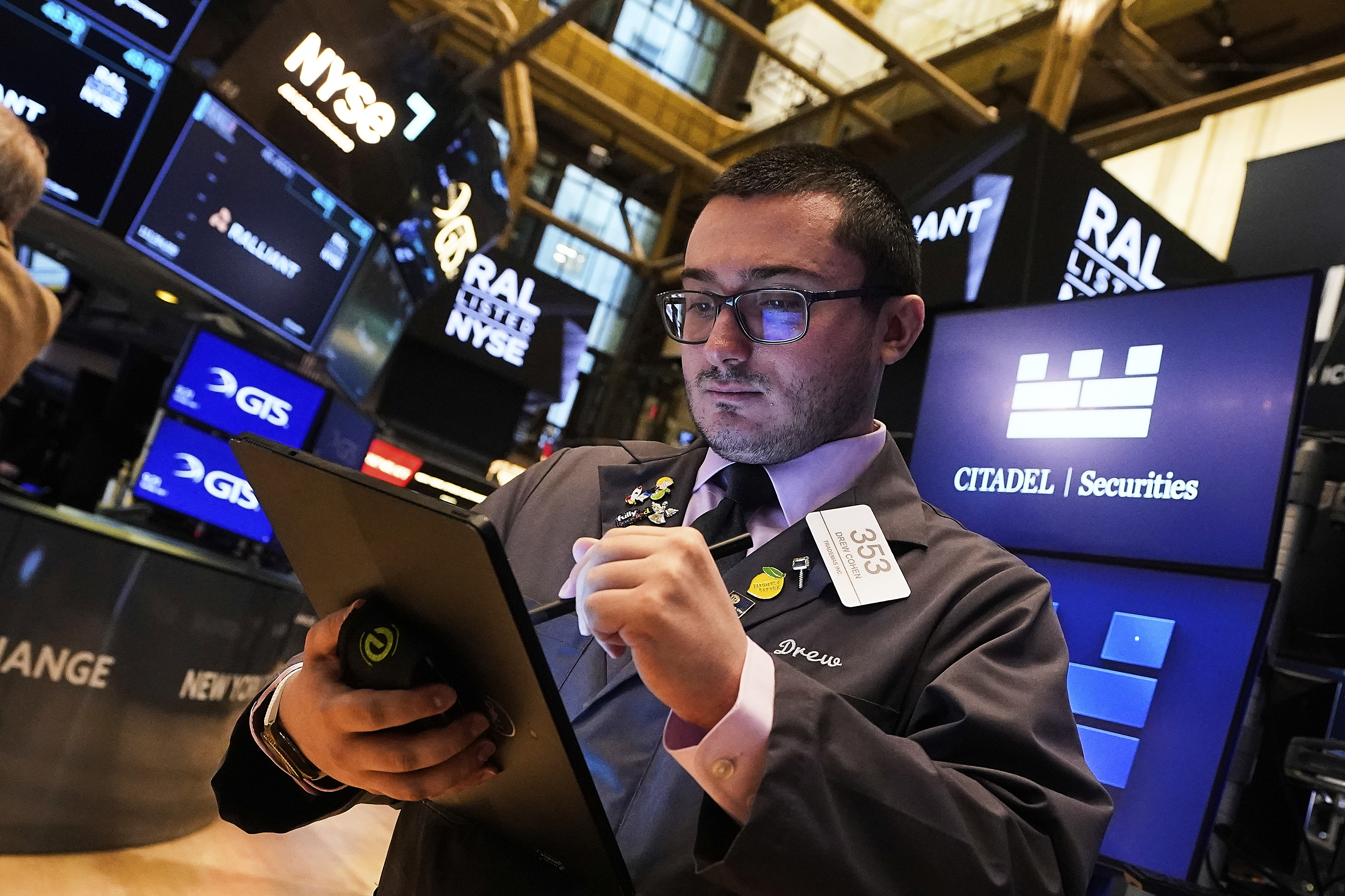 Trader Drew Cohen works on the floor of the New York Stock Exchange, Tuesday, July 1, 2025. (AP Photo/Richard Drew)