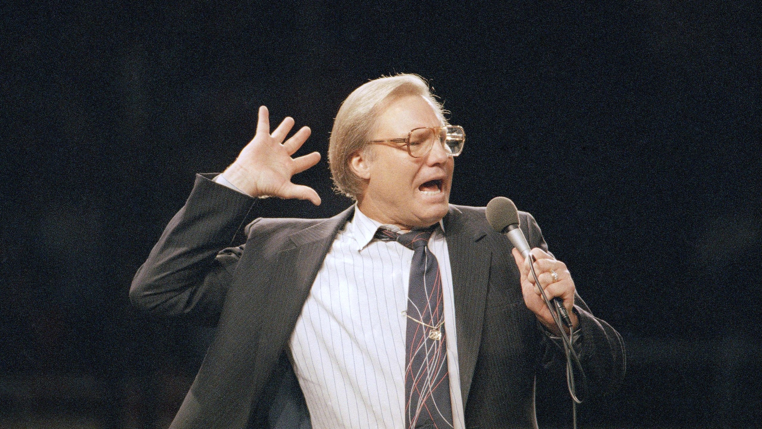 FILE - The Rev. Jimmy Swaggart gestures as he preaches the Gospel to the nearly 14,000 faithful who attended his Los Angeles Crusade in the Sports Arena, Sunday, March 29, 1987. (AP Photo/Mark Avery, file)