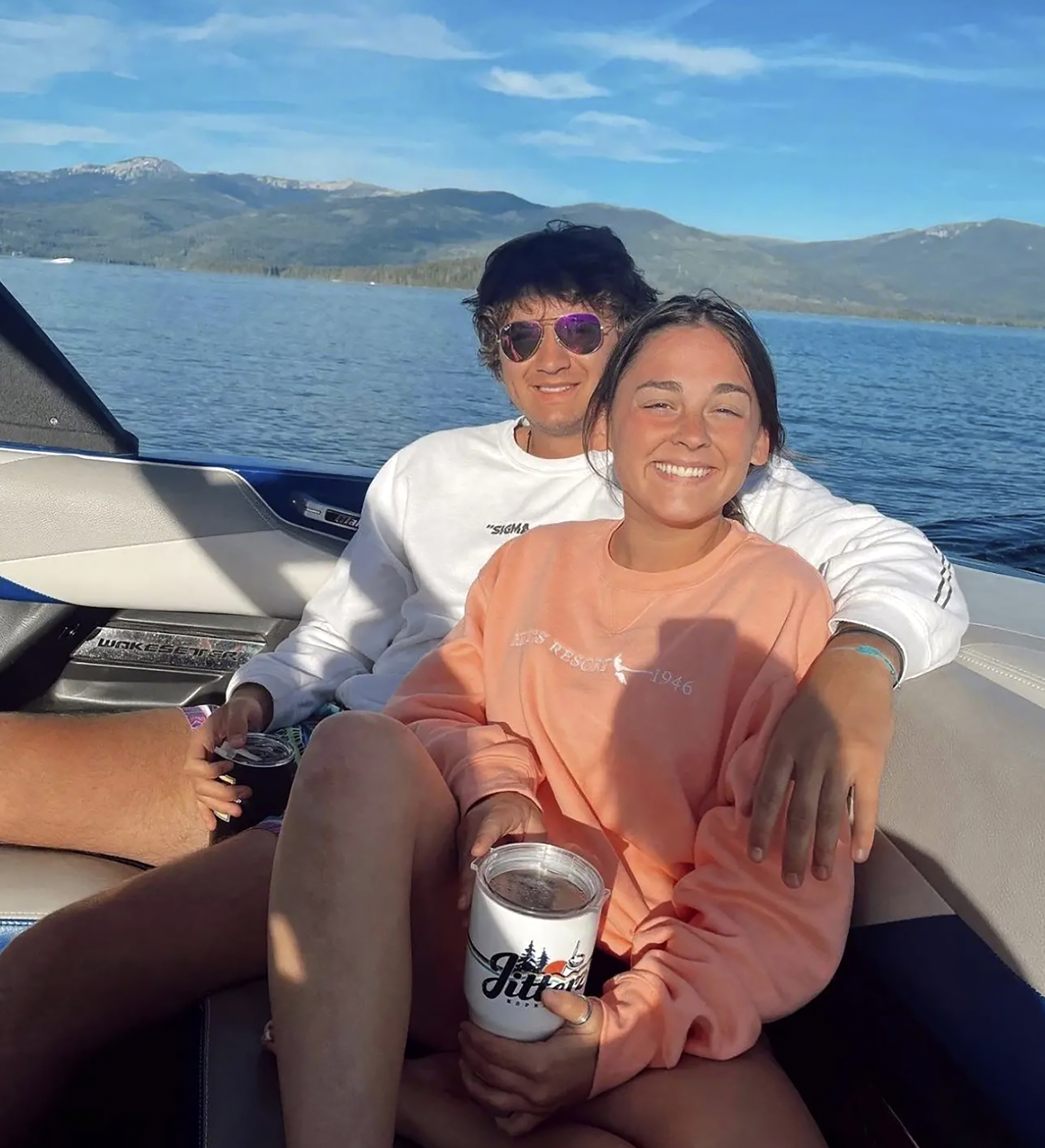 This July 2022 photo provided by Jazzmin Kernodle shows University of Idaho students Xana Kernodle, right, and Ethan Chapin on a boat on Priest Lake, in Idaho. Both students were among four found stabbed to death in an off-campus rental home on Nov. 13. (Jazzmin Kernodle via AP)