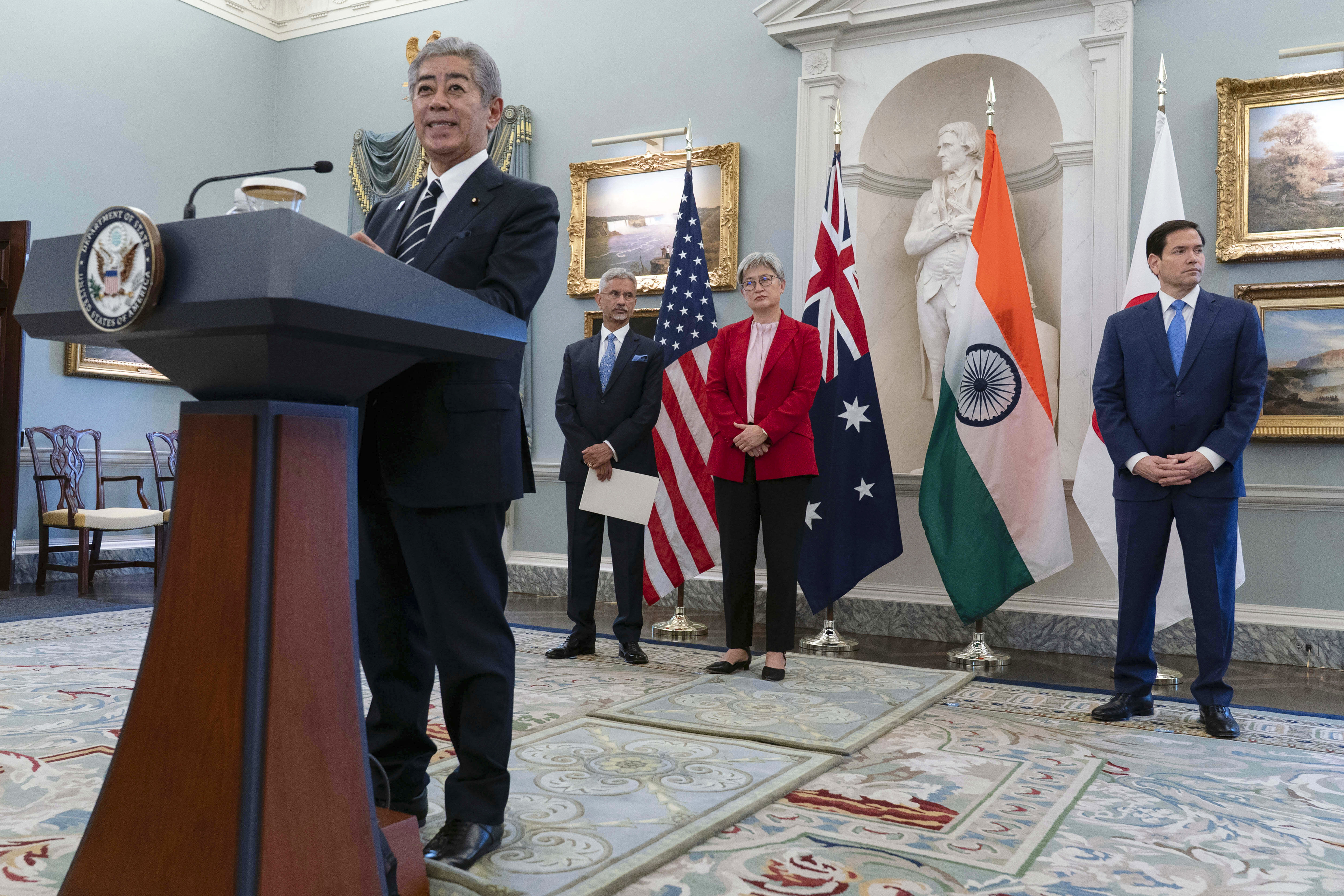 Japanese Foreign Minister Iwaya Takeshi flanked by from left Indian External Affairs Minister Subrahmanyam Jaishankar, Australian Foreign Minister Penny Wong and Secretary of State Marco Rubio speaks to the media before the Indo-Pacific Quad meeting at the State Department in Washington, Tuesday, July 1, 2025. (AP Photo/Jose Luis Magana)