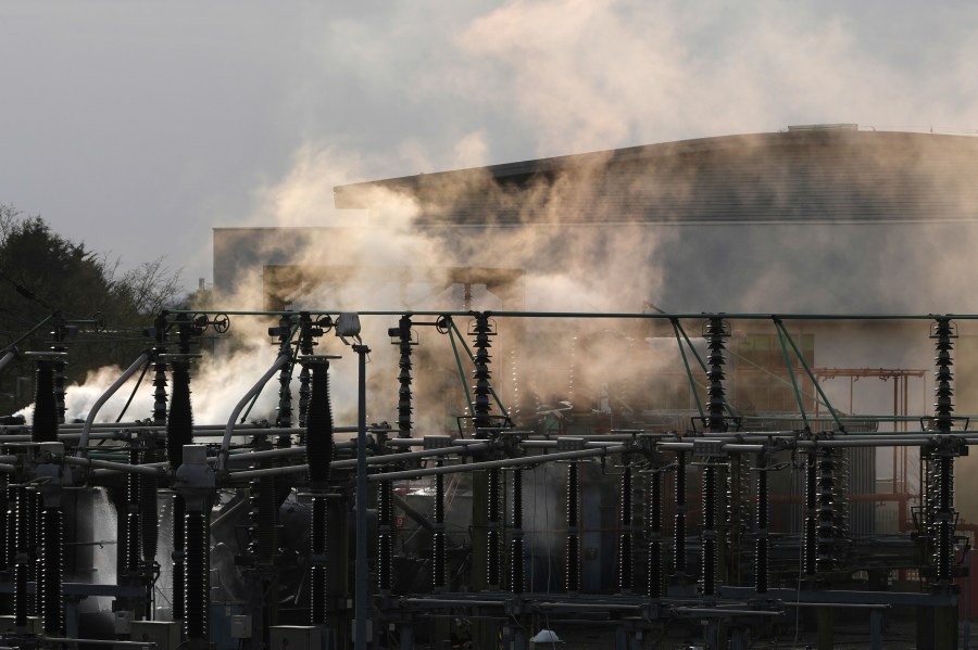 FILE -Smoke rises from the North Hyde electrical substation, which caught fire last night, leading to the closure of the Heathrow Airport, in London, March 21, 2025.(AP Photo/Kirsty Wigglesworth), File)