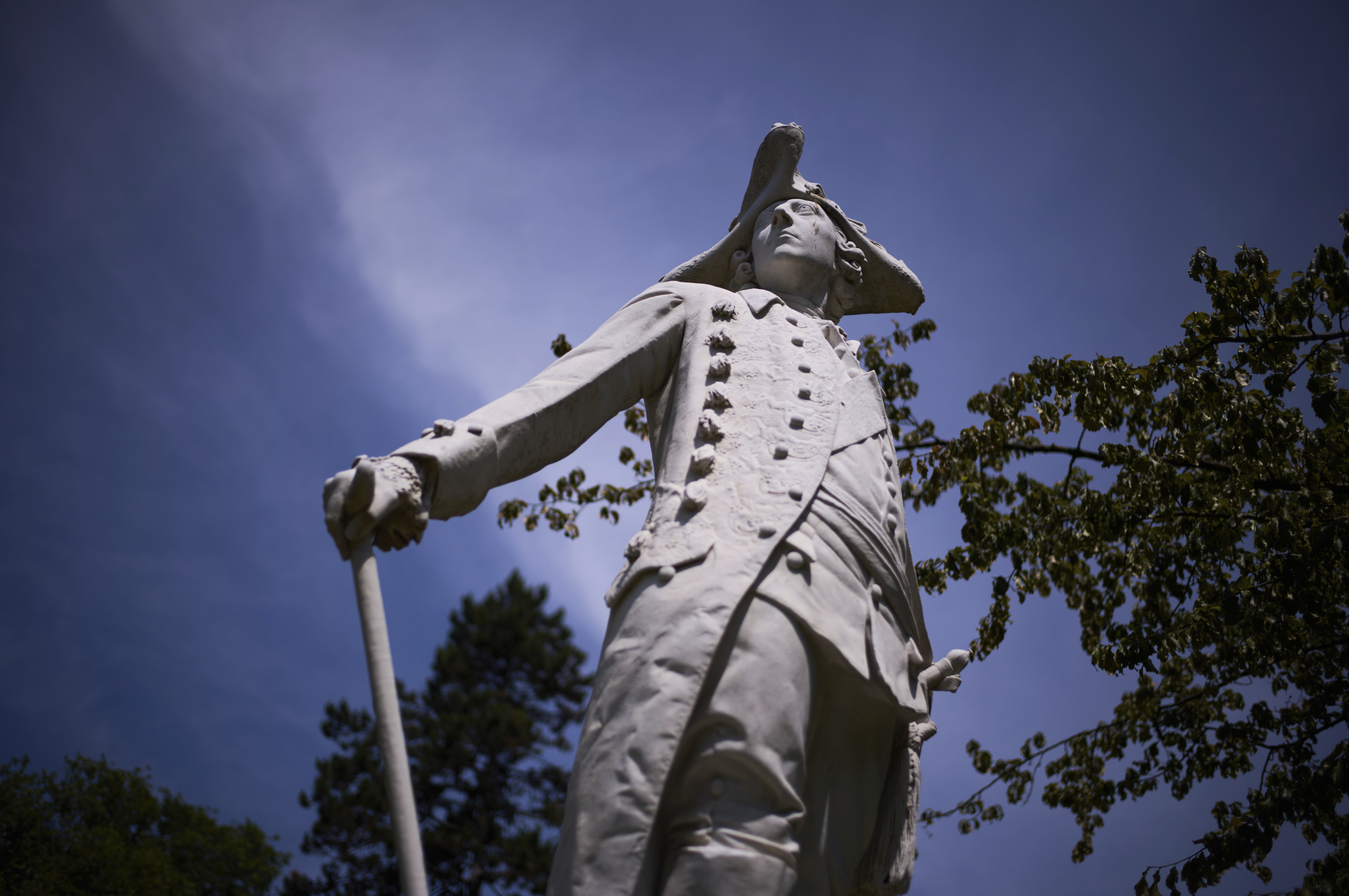 A statue of King Frederick II of Prussia stands in the park of Sanssouci Palace in Potsdam, Germany, June 17, 2025. (AP Photo/Markus Schreiber)