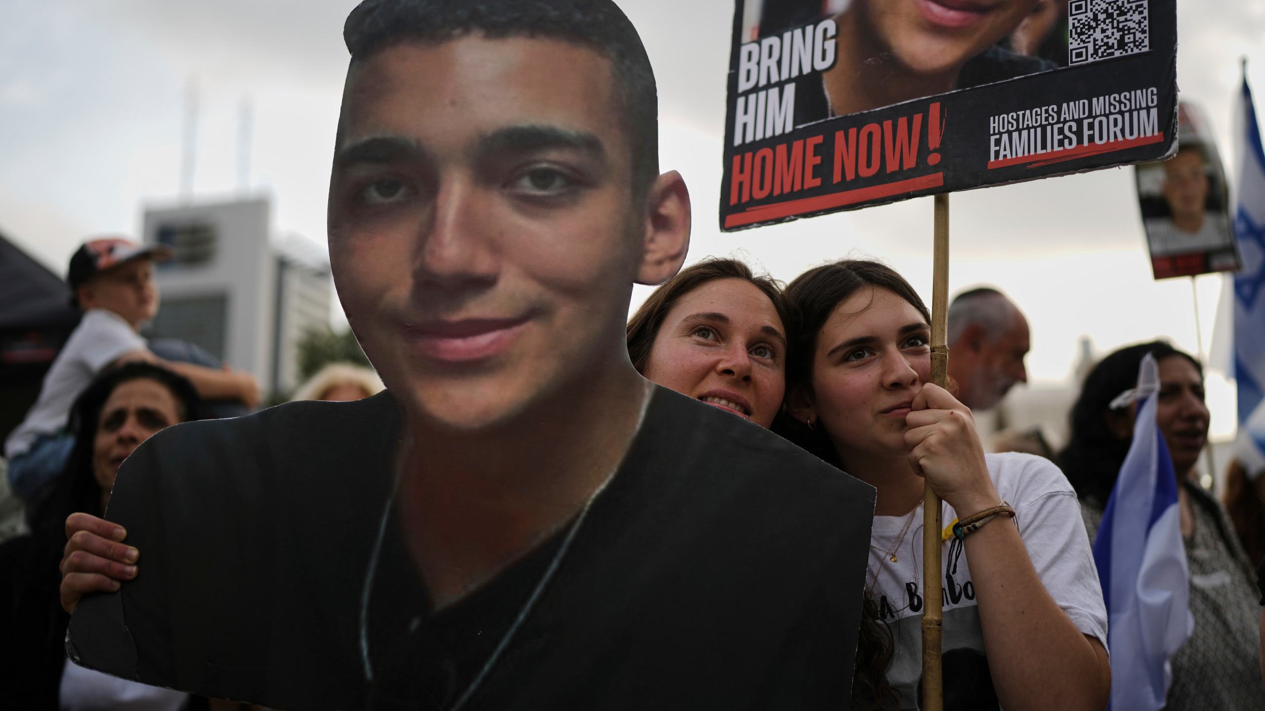 FILE - People watch a live broadcast of Israeli-American soldier Edan Alexander as he is released from Hamas captivity in Gaza, at a plaza known as the hostages square in Tel Aviv, Monday, May 12, 2025. (AP Photo/Oded Balilty, File)