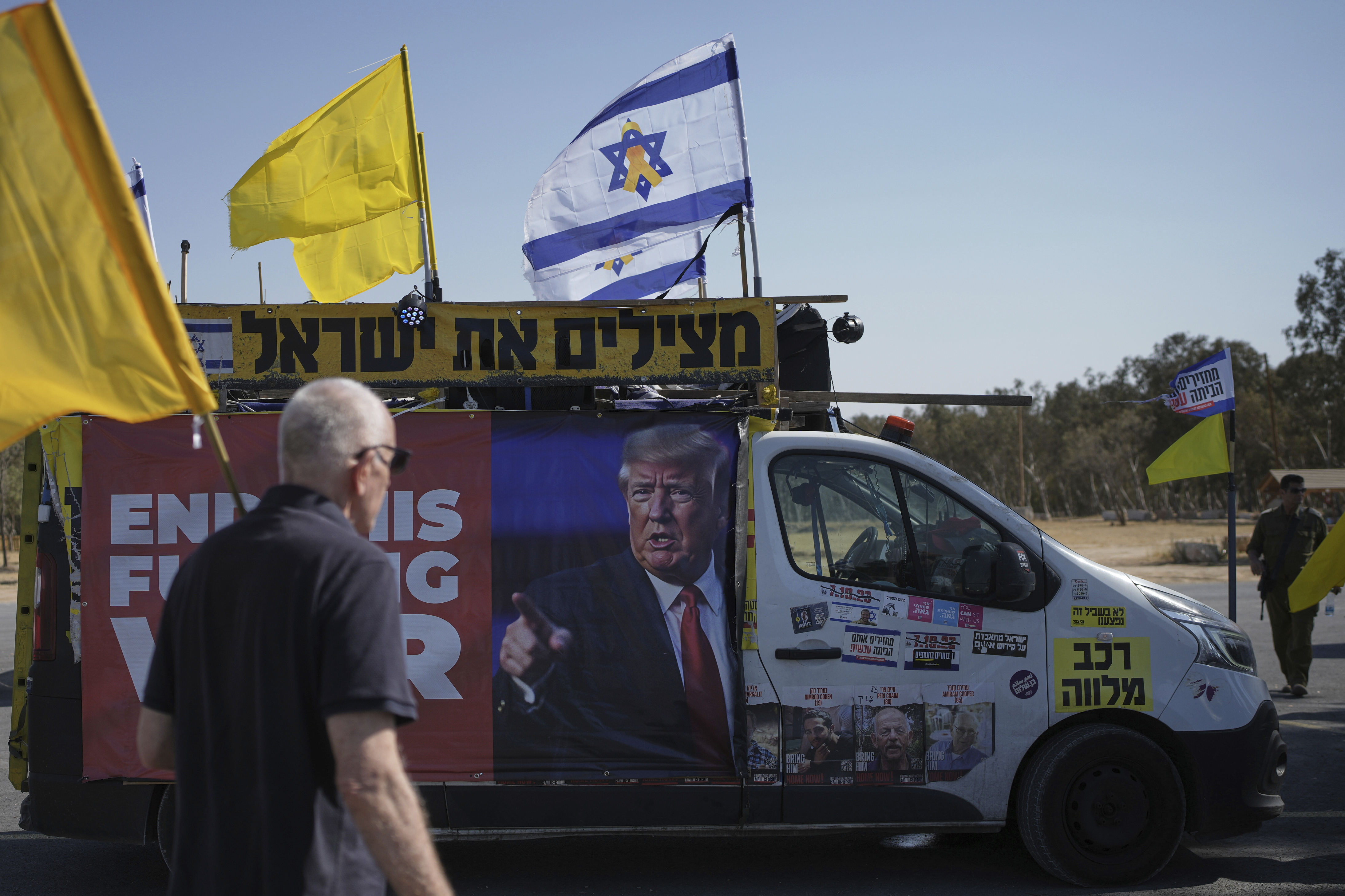 People take part in a protest demanding an end to the war and the immediate release of hostages held by Hamas in the Gaza Strip, at the site of the October 7, 2023 Hamas attack on the Nova music festival near Kibbutz Reim, southern Israel, Wednesday, July 2, 2025. (AP Photo/Ohad Zwigenberg)