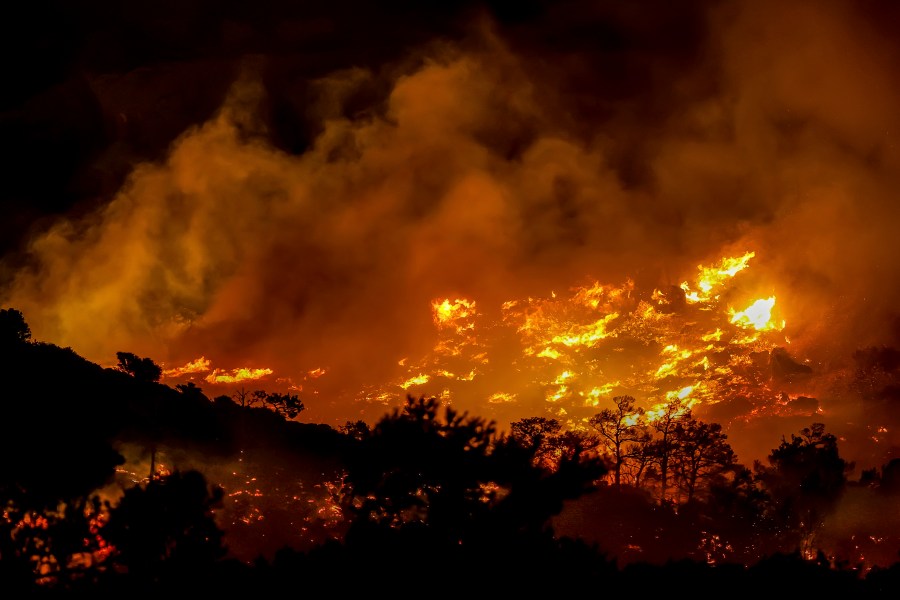 Fire burns in the Ahlia area near the port town of Ierapetra on the south coast of Crete island, Greece, late Wednesday, July 2, 2025, prompting the evacuation of villages and hotels in the region, authorities said. (InTime News via AP)