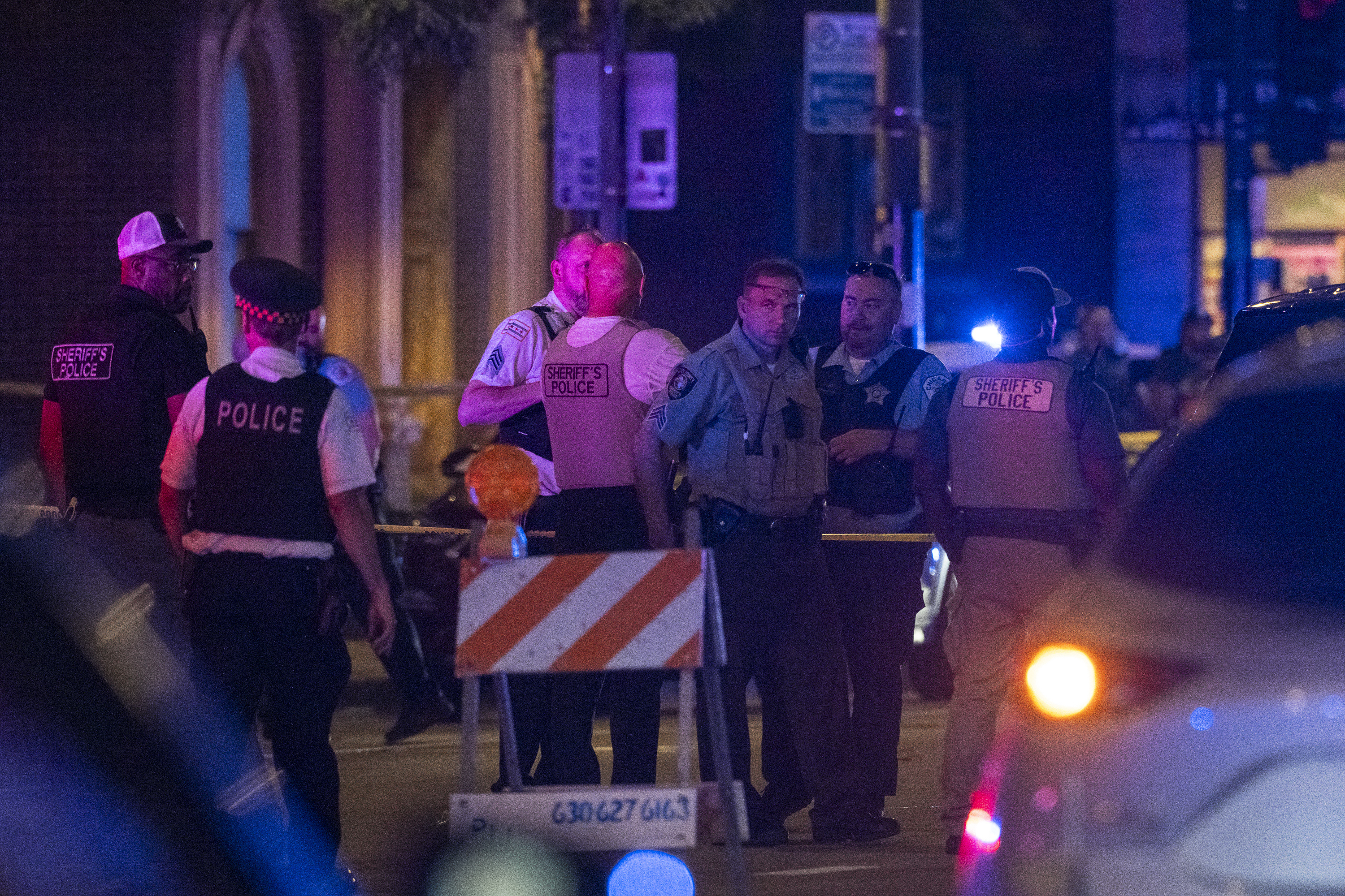 Chicago police investigate the scene of a shooting that took place at Artis Restaurant and Lounge located Chicago Avenue in the River North neighborhood, Thursday, July 3, 2025. (Tyler Pasciak LaRiviere/Chicago Sun-Times via AP)