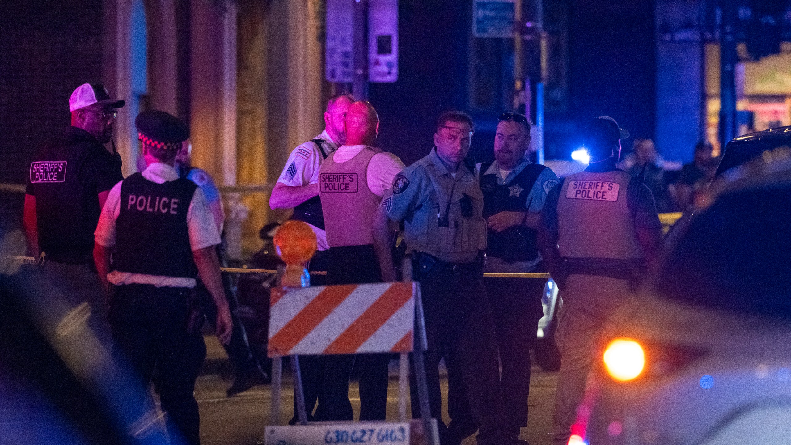 Chicago police investigate the scene of a shooting that took place at Artis Restaurant and Lounge located Chicago Avenue in the River North neighborhood, Thursday, July 3, 2025. (Tyler Pasciak LaRiviere/Chicago Sun-Times via AP)