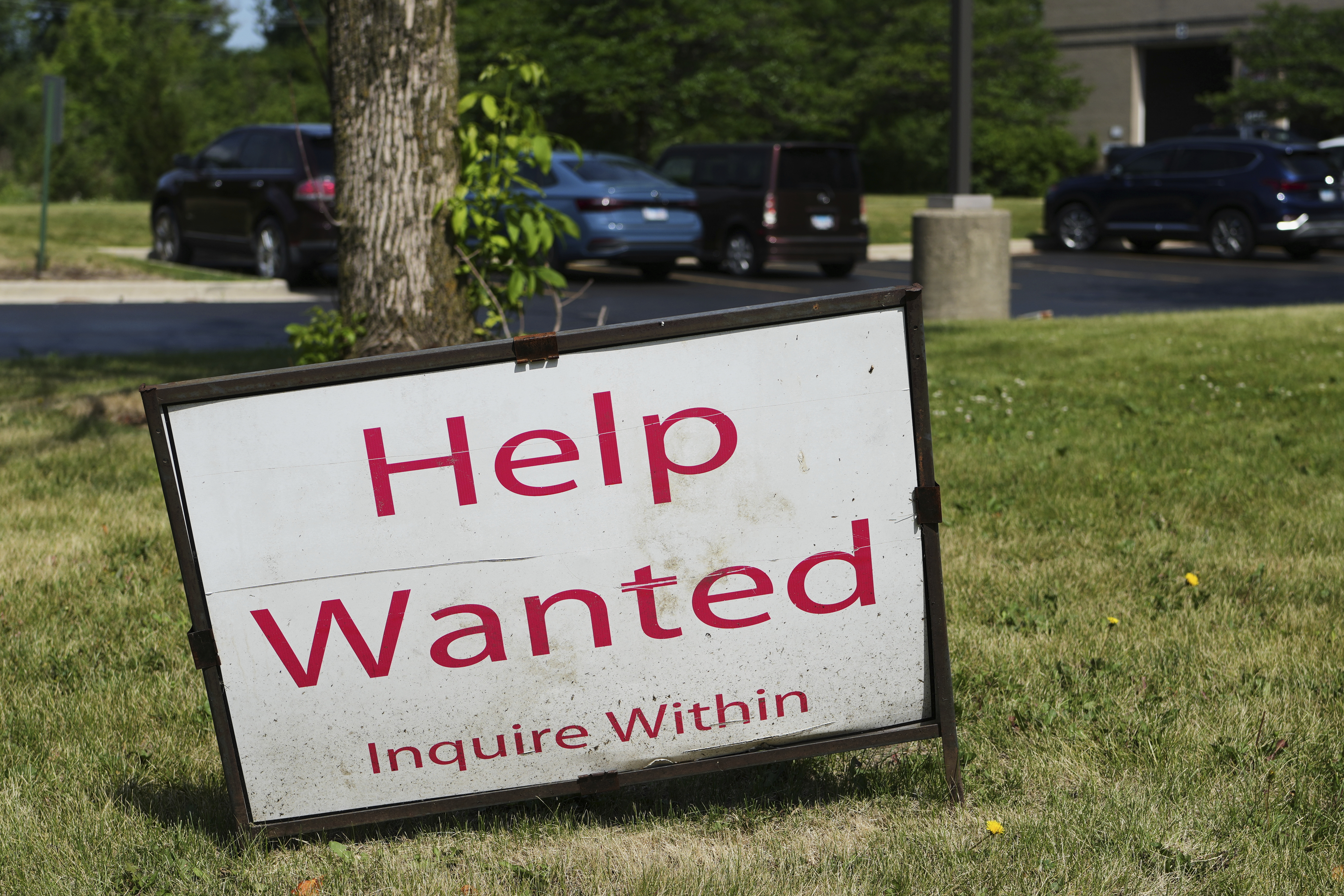 A "Help Wanted" sign is displayed at Illinois Air Team Test Station Saturday, June 21, 2025, in Lincolnshire, Ill. (AP Photo/Nam Y. Huh)