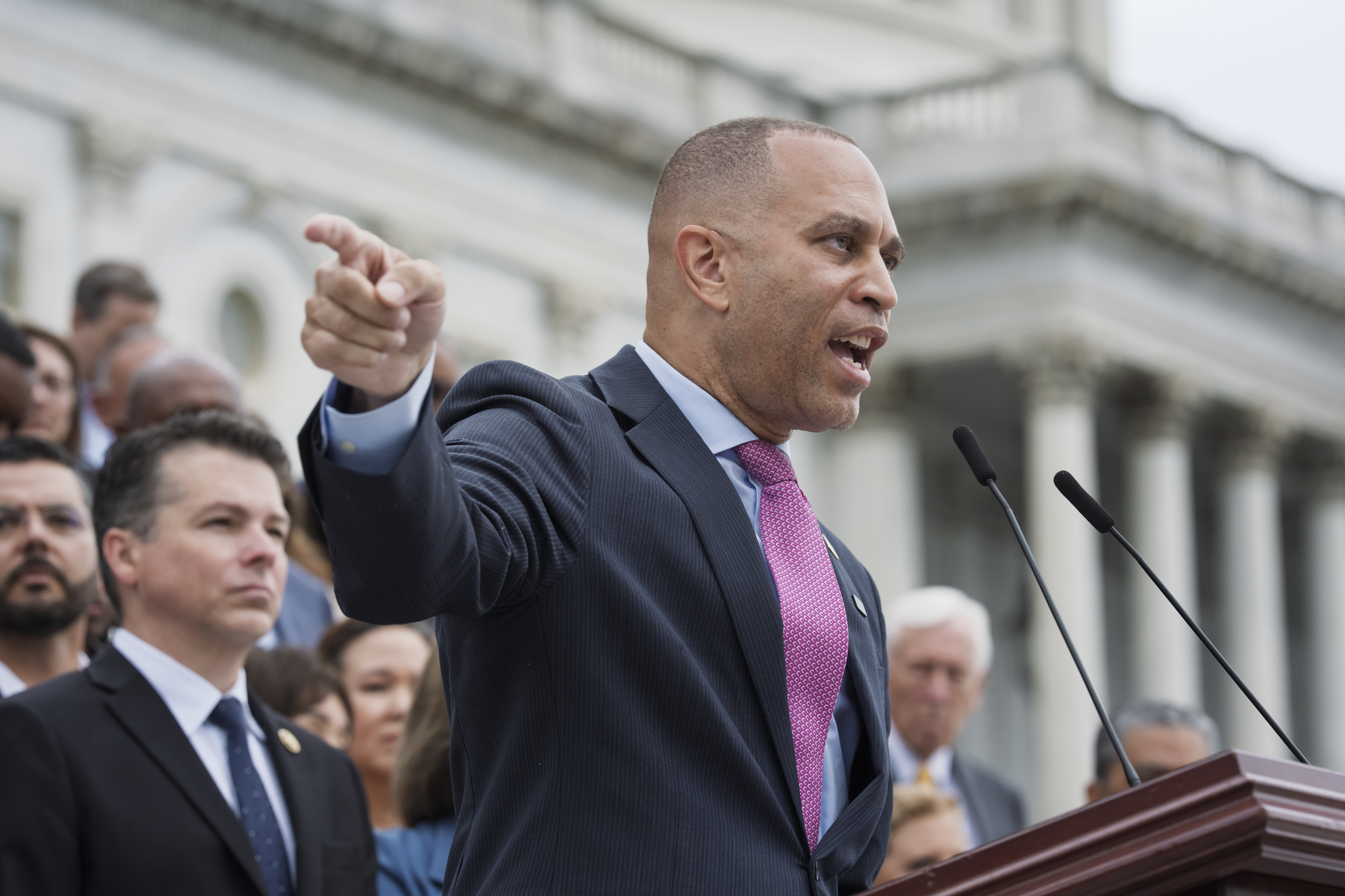 House Minority Leader Hakeem Jeffries, D-N.Y., and the Democratic Caucus, assemble on the steps of the Capitol to condemn President Donald Trump's signature bill of tax breaks and spending cuts, in Washington, Wednesday, July 2, 2025. (AP Photo/J. Scott Applewhite)