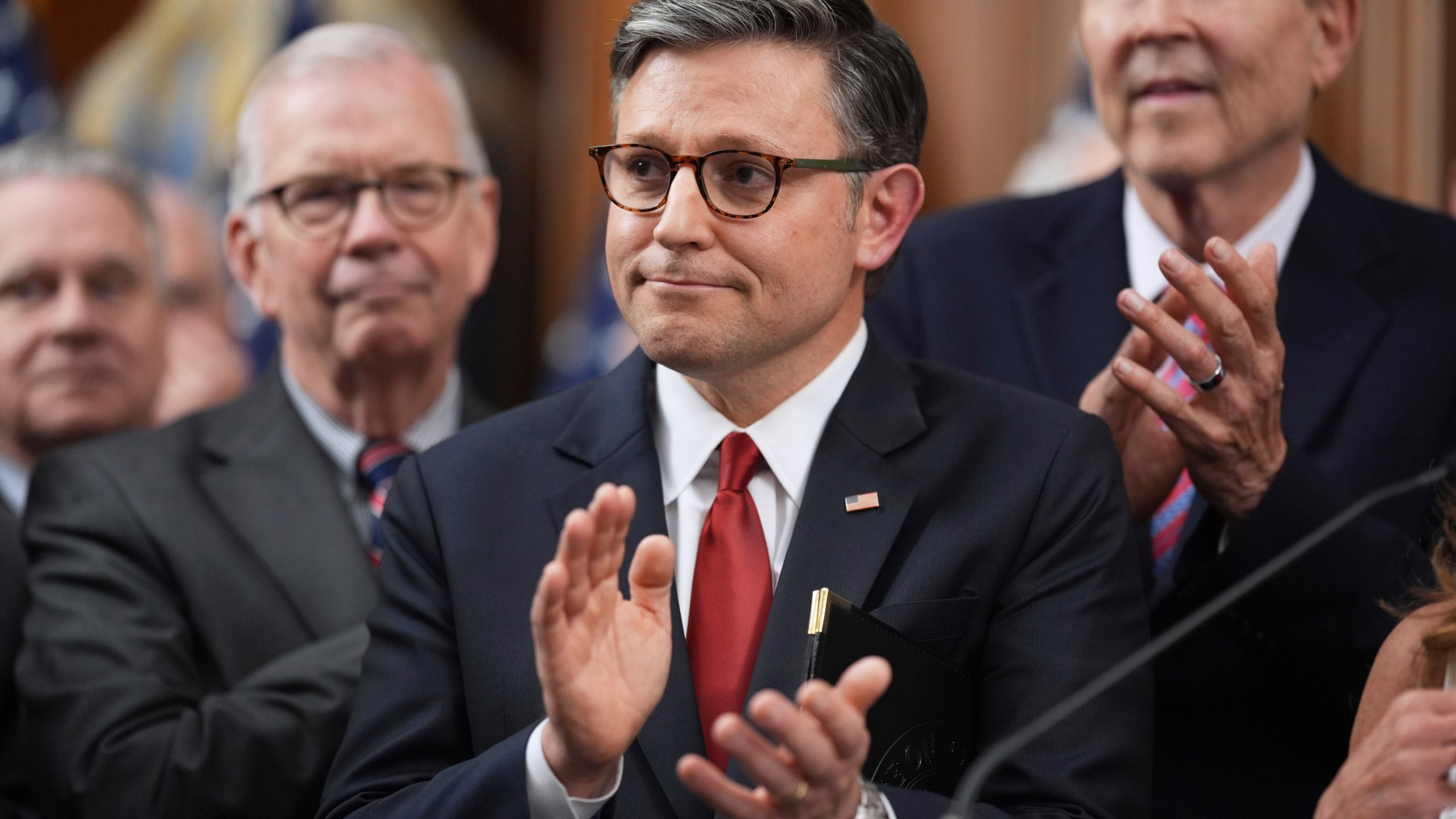 Speaker of the House Mike Johnson, R-La., is seen with other Republican House members after the passage of President Donald Trump's signature bill of tax breaks and spending cuts, at the Capitol in Washington, Thursday, July 3, 2025. (AP Photo/J. Scott Applewhite)