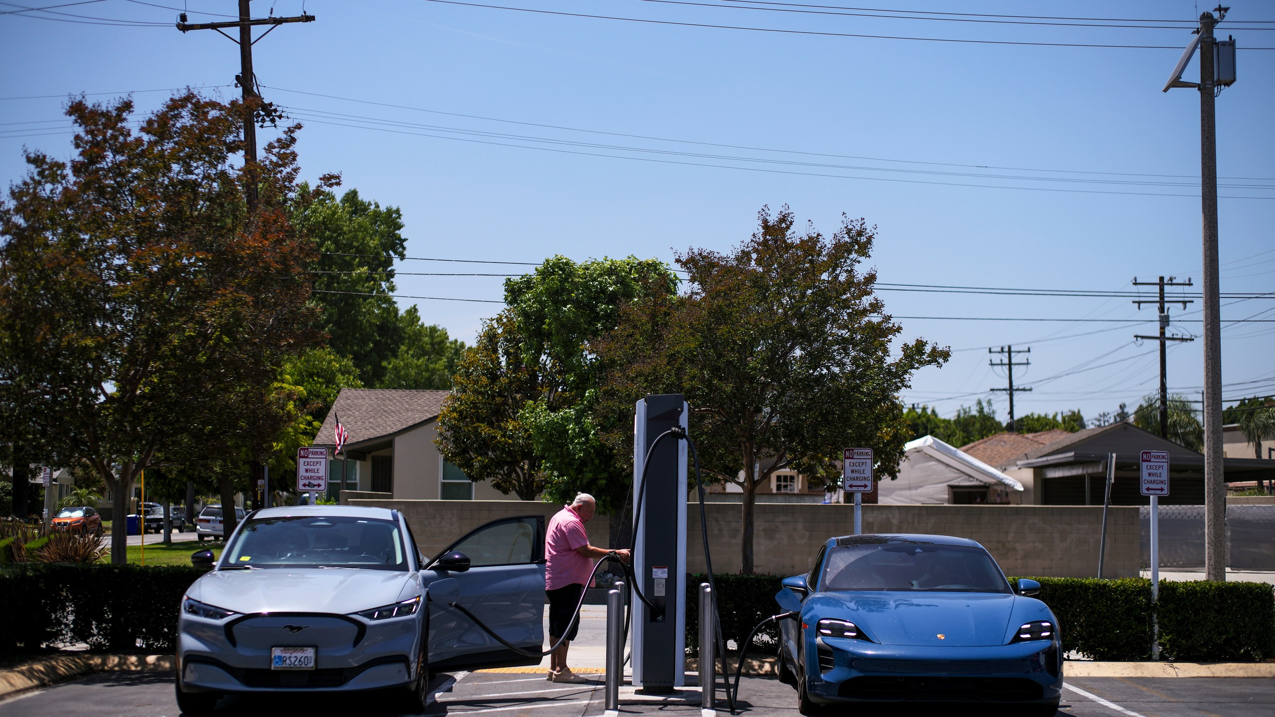 FILE - Electric vehicles charge at an Electrify America station in Arcadia, Calif., May 22, 2025. (AP Photo/Jae C. Hong, File)