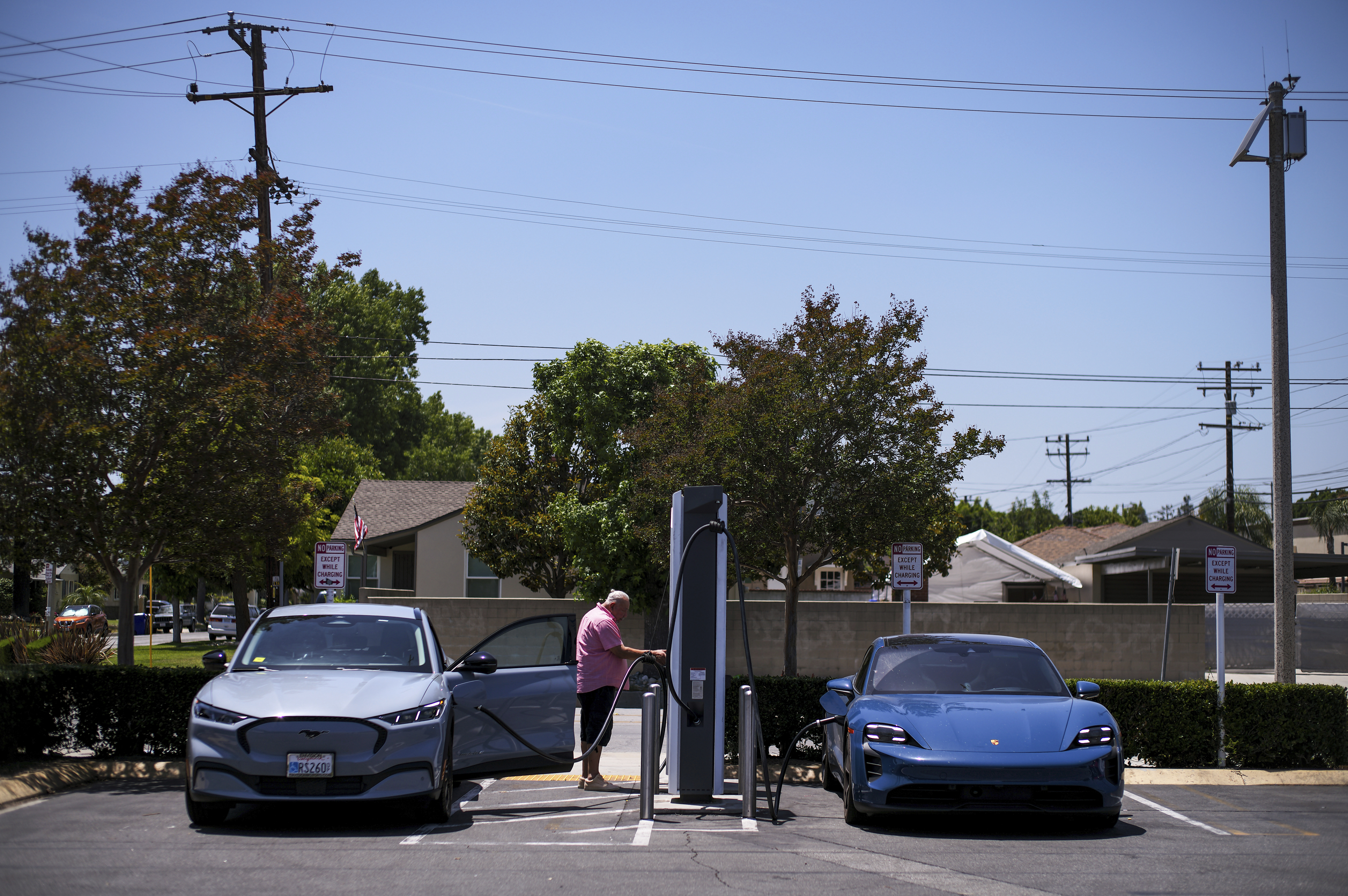 FILE - Electric vehicles charge at an Electrify America station in Arcadia, Calif., May 22, 2025. (AP Photo/Jae C. Hong, File)