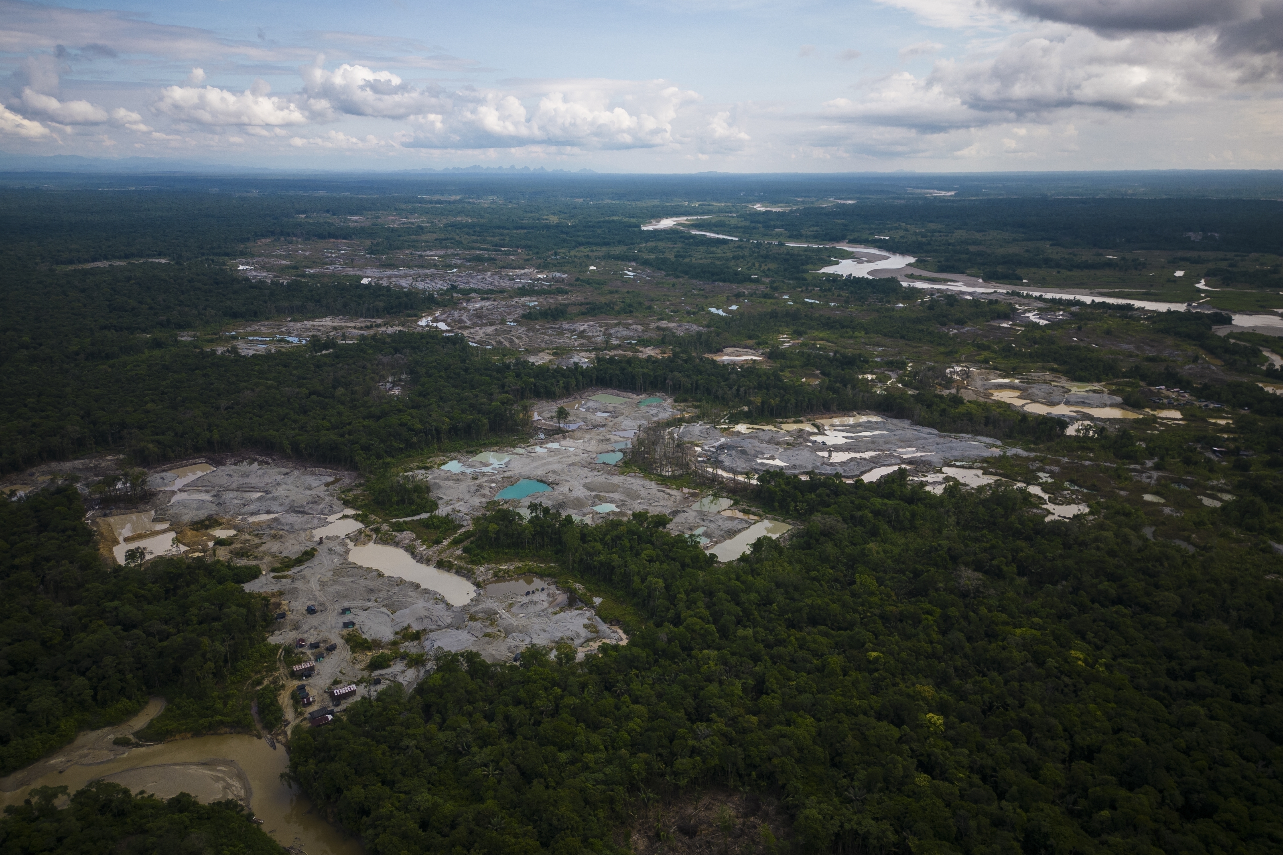 FILE - Visible deforestation from illegal mining surrounds the Quito River, near Paimado, Colombia, Sept. 23, 2024. (AP Photo/Ivan Valencia, File)