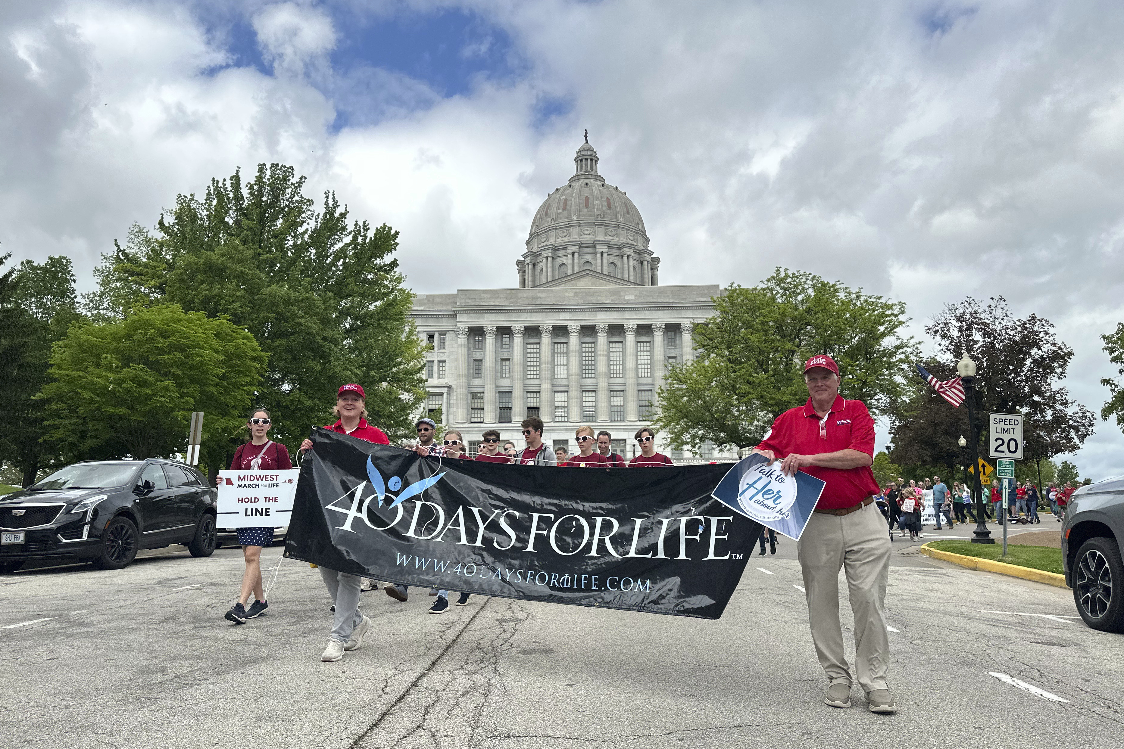 FILE - Participants in the Midwest March for Life walk through the streets of Jefferson City, Mo., in front of the state Capitol on May 1, 2025. (AP Photo/David A. Lieb, File)