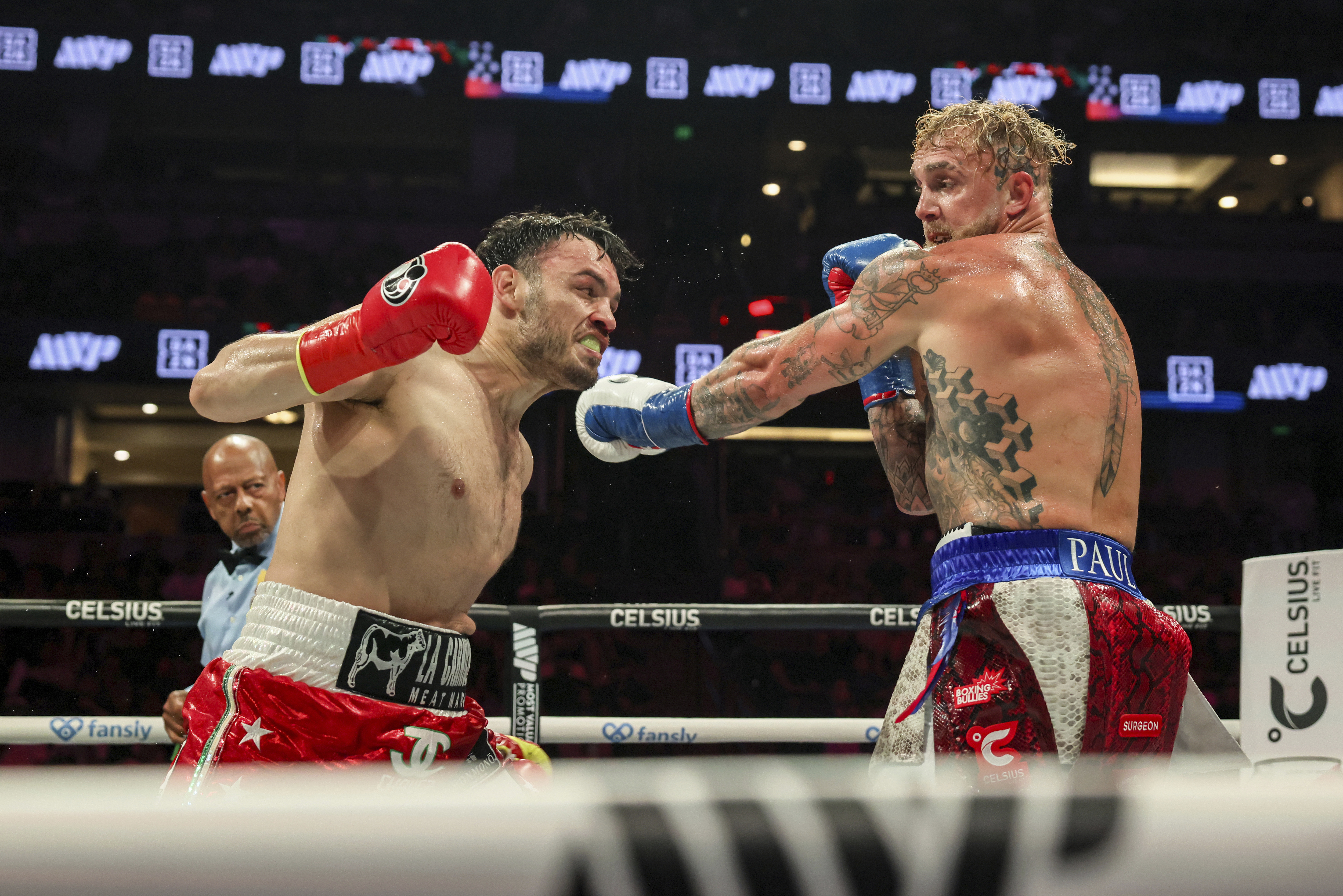 FILE - Julio Cesar Chavez Jr., left, throws a punch at Jake Paul during their cruiserweight boxing match, in Anaheim, Calif., June 28, 2025. (AP Photo/Etienne Laurent, File)