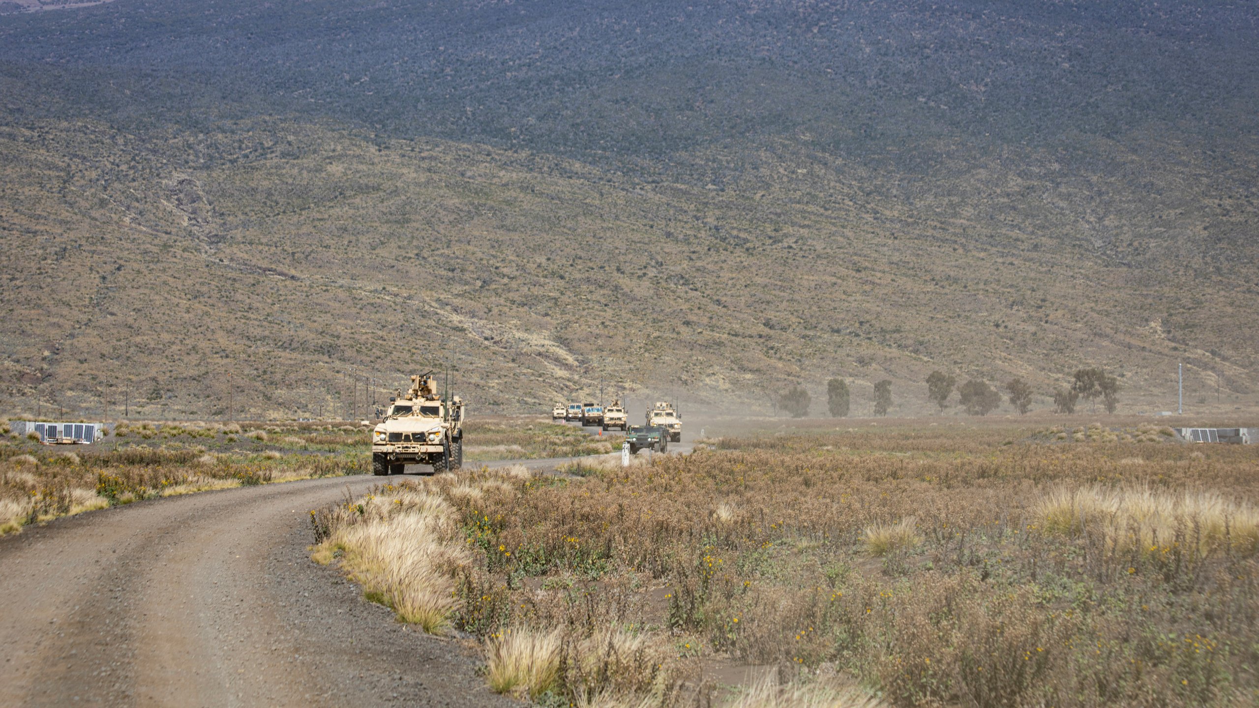 In this photo released by the U.S. Army, soldiers conduct a convoy escort team during Operation PIKO, the 25th Division Sustainment Brigade's annual gunnery Feb. 5, 2025, at Pohakuloa Training Area, Hawaii. (Sgt. Jared Simmons, U.S. Army via AP)