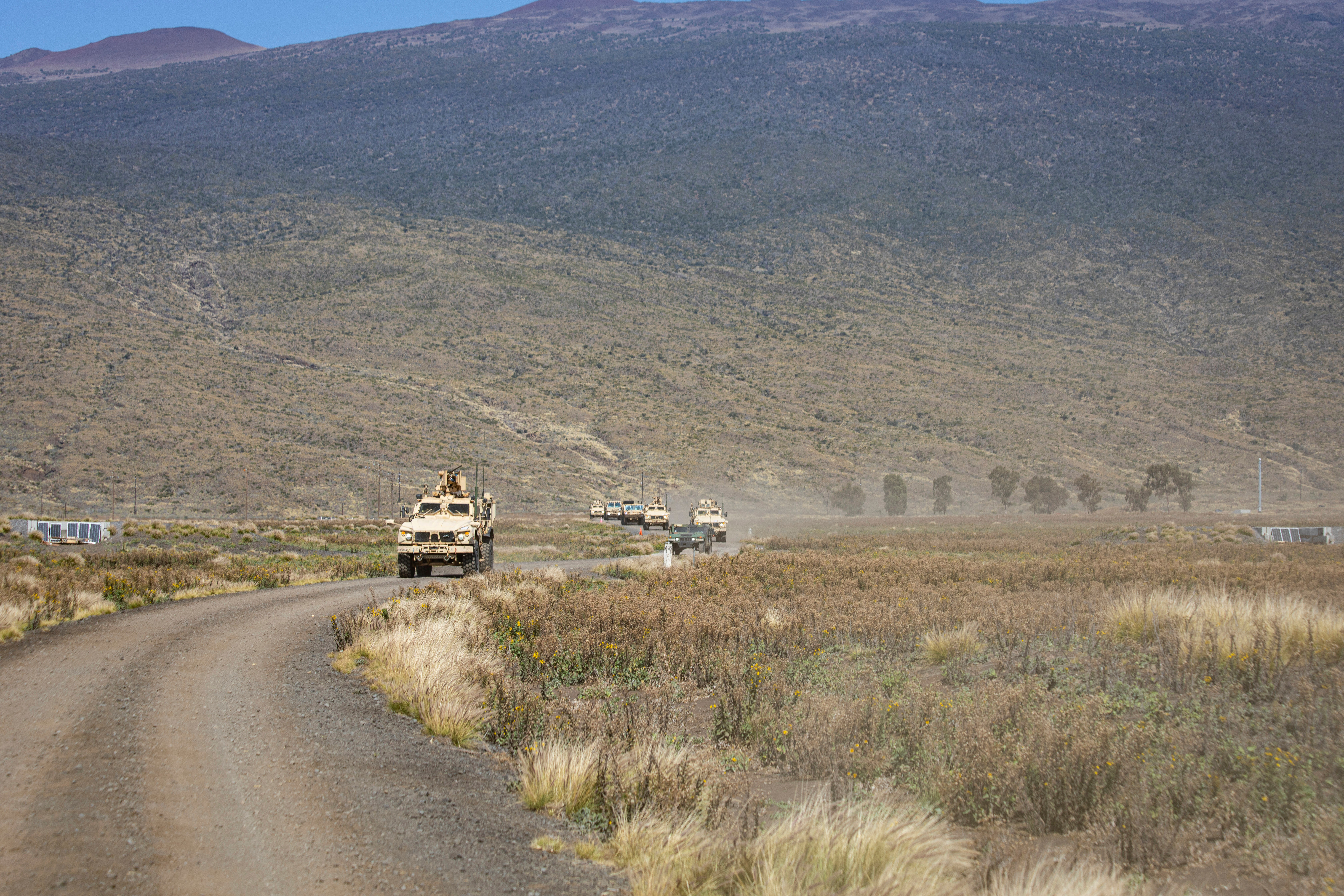 In this photo released by the U.S. Army, soldiers conduct a convoy escort team during Operation PIKO, the 25th Division Sustainment Brigade's annual gunnery Feb. 5, 2025, at Pohakuloa Training Area, Hawaii. (Sgt. Jared Simmons, U.S. Army via AP)