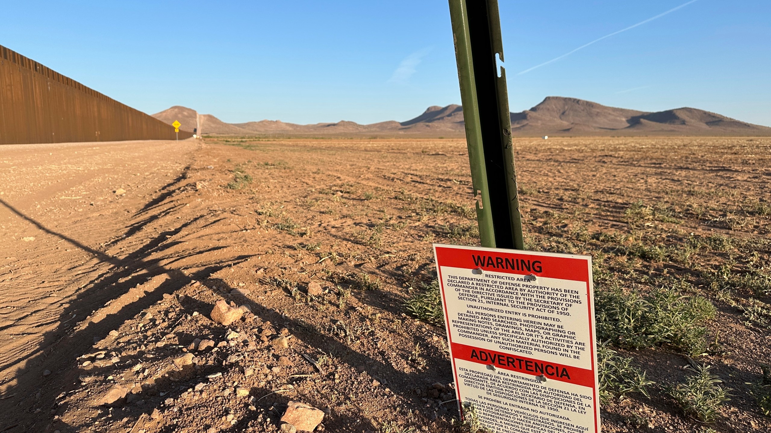 A sign warns against unauthorized entry into a militarized zone along the southern U.S. border in New Mexico on June 12, 2025. (AP Photo/Morgan Lee)