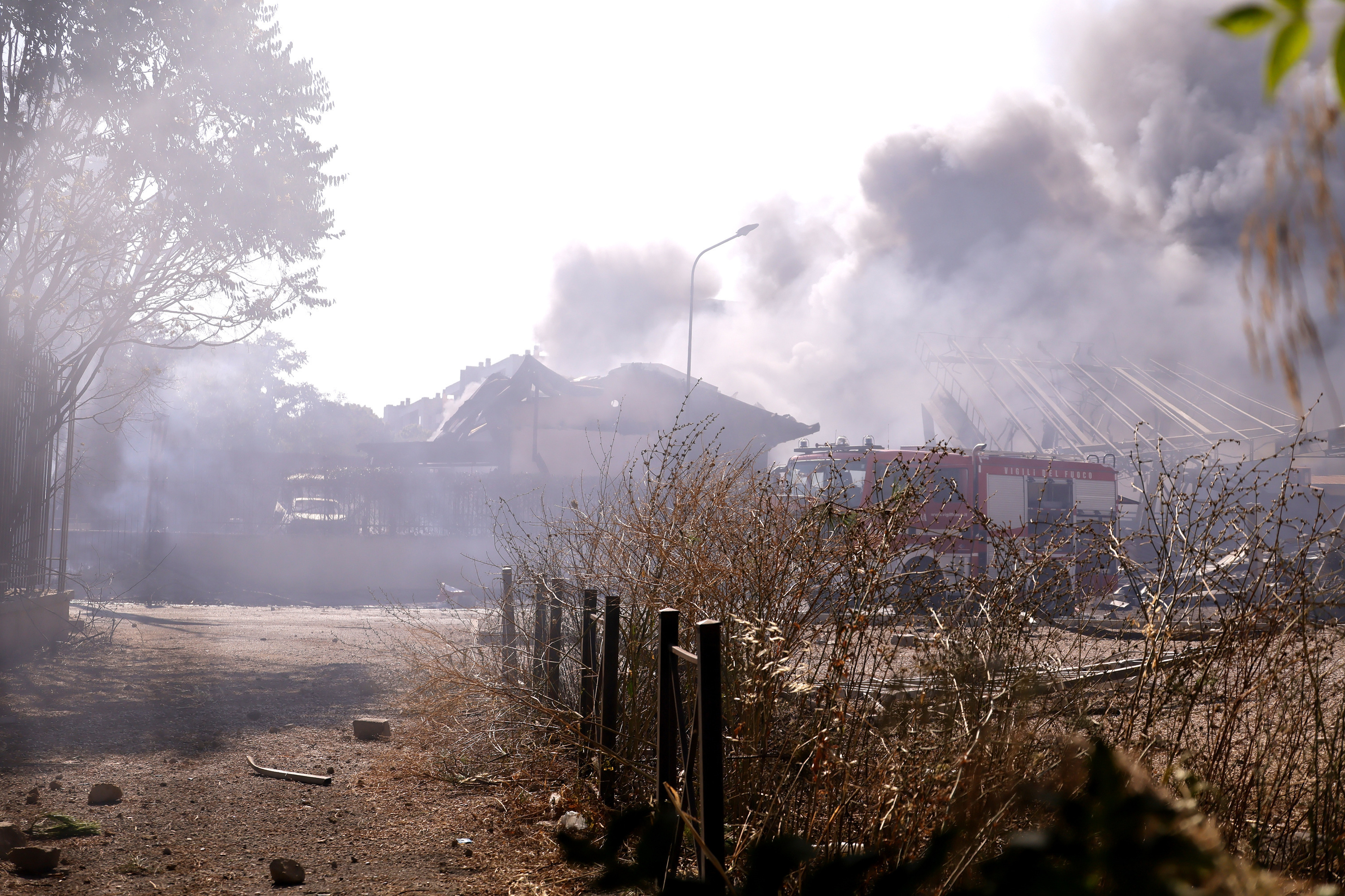 Firefighters work as smoke rises after a gas station exploded on the outskirts of Rome, Friday, July 4, 2025. (Cecilia Fabiano/LaPresse via AP)