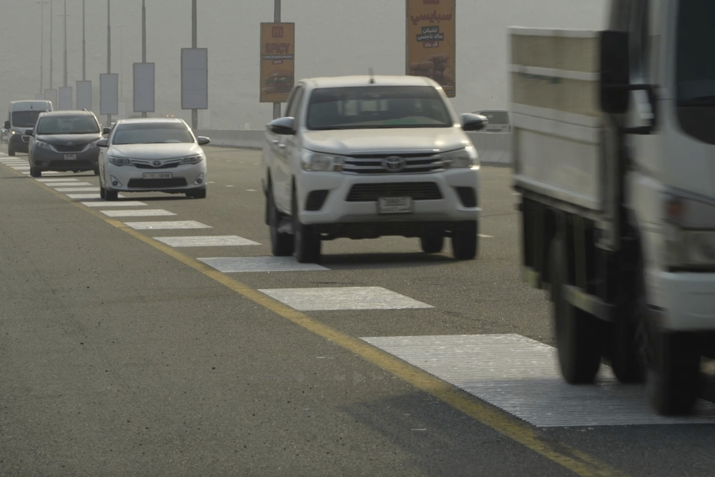 Vehicles drive over rumble strips that play Ludwig van Beethoven's Ninth Symphony on a highway in Fujairah, United Arab Emirates, Thursday, July 3, 2025. (AP Photo/Bassam Hatoum)