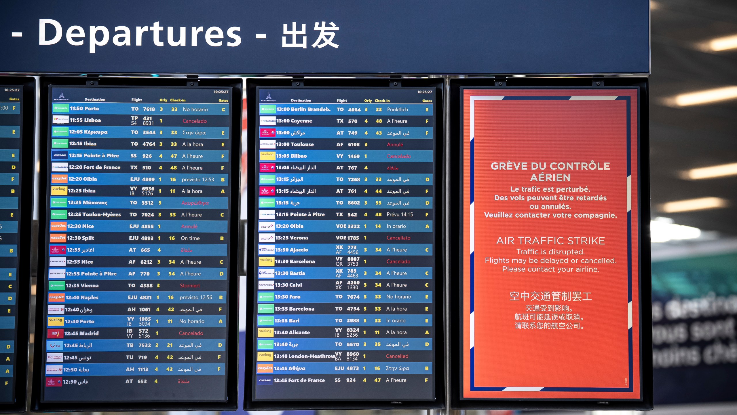 A departures information board is seen at Orly airport, near Paris, as French air traffic controllers launched a two-day strike to demand better working conditions, Friday, July 4, 2025. (AP Photo/Aurelien Morissard)