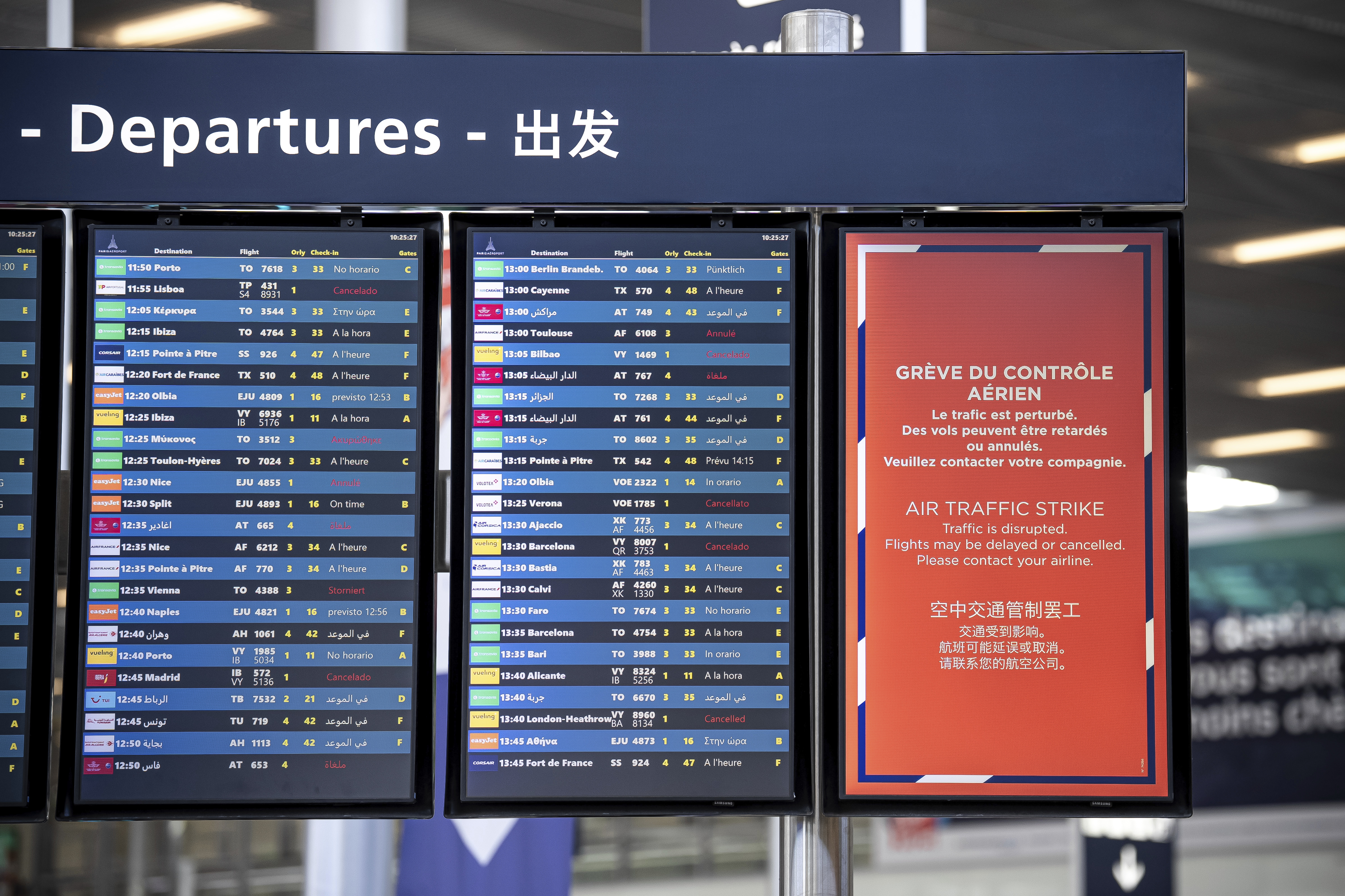 A departures information board is seen at Orly airport, near Paris, as French air traffic controllers launched a two-day strike to demand better working conditions, Friday, July 4, 2025. (AP Photo/Aurelien Morissard)