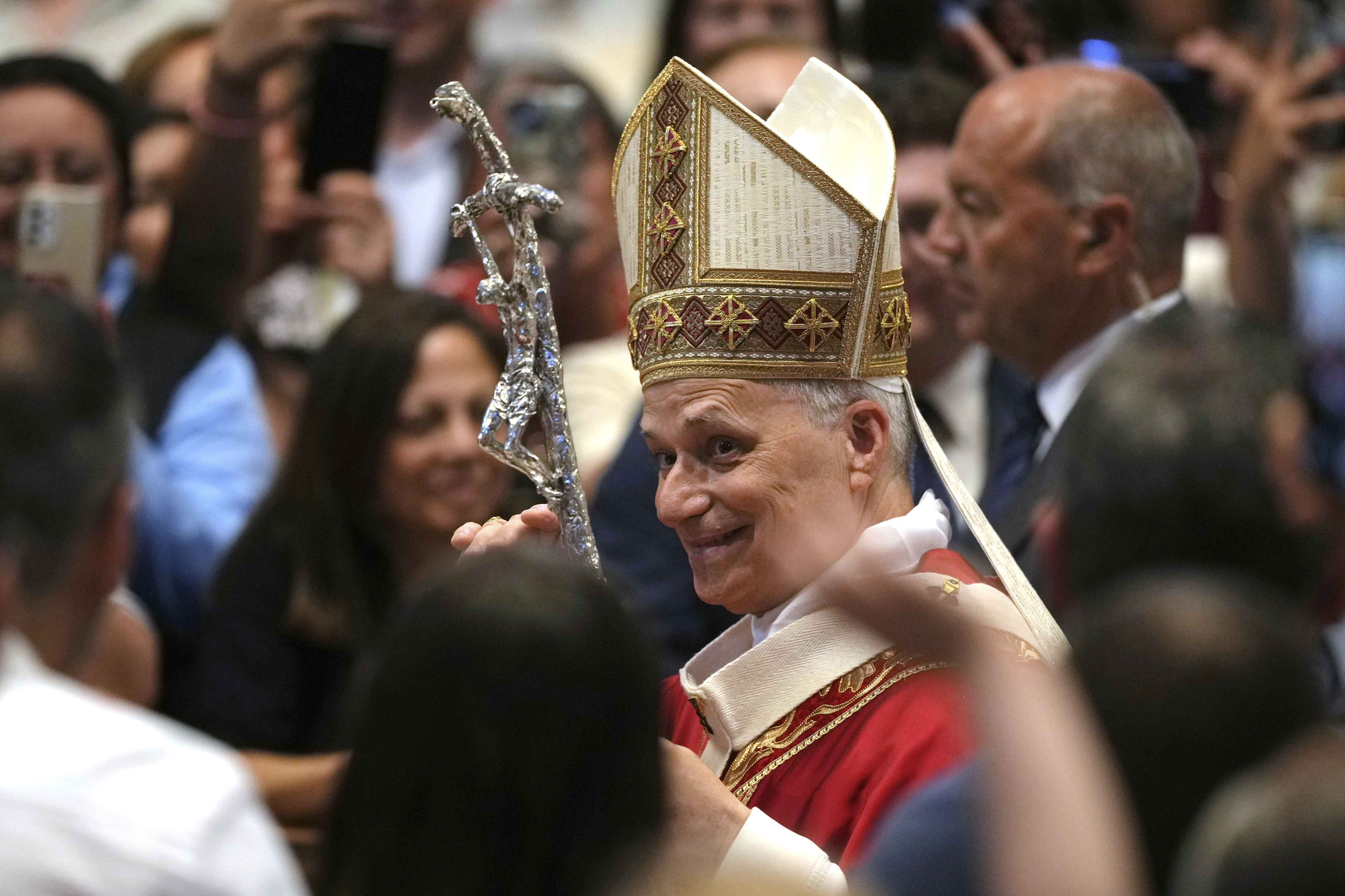 FILE - Pope Leo XIV leaves after celebrating a Mass in St. Peter's Basilica at the Vatican, Sunday, June 29, 2025, where he conferred the pallium on newly appointed metropolitan archbishops. (AP Photo/Andrew Medichini, File)
