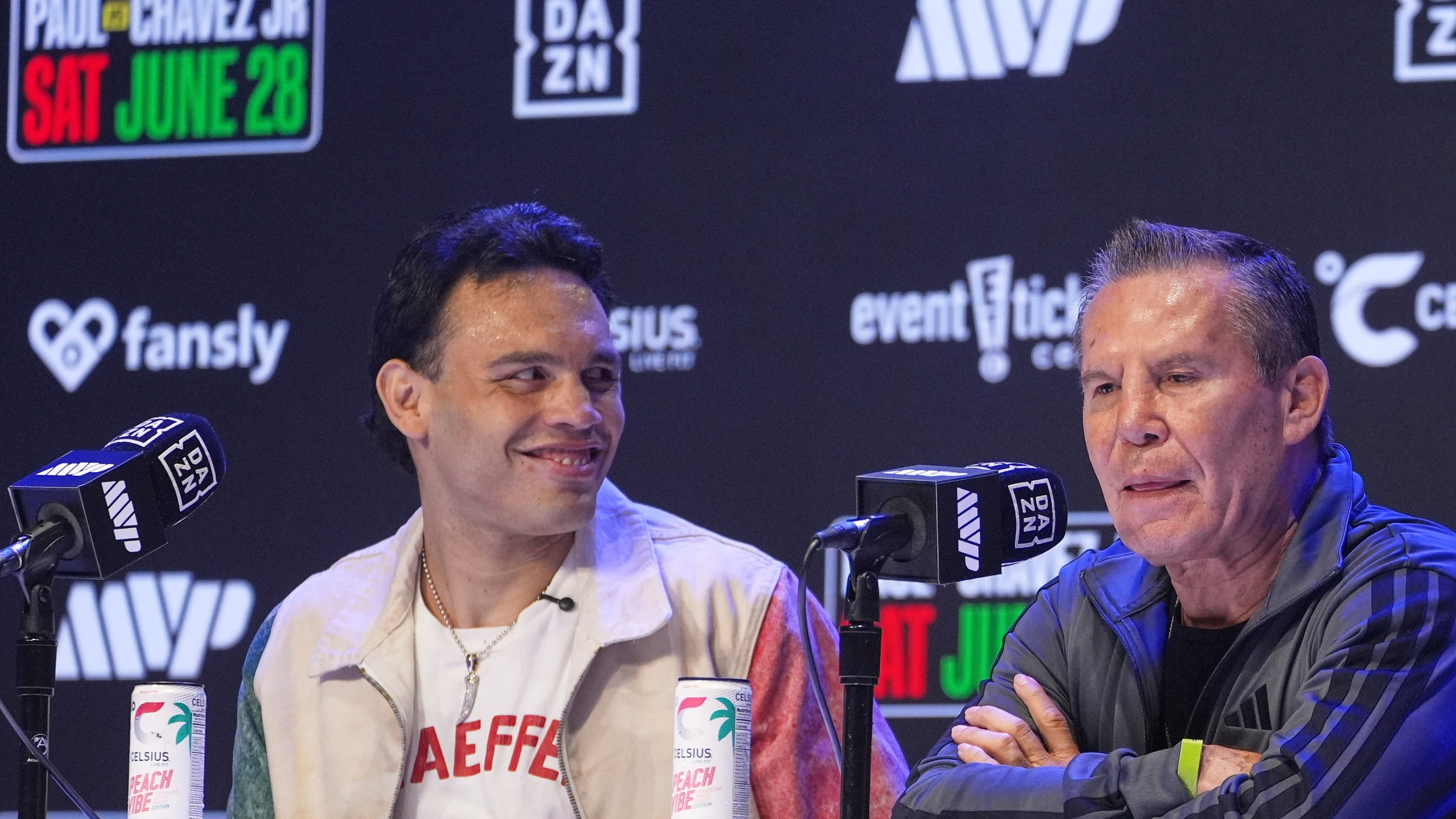 FILE - Boxers Cesar Chavez Jr,, left, smiles towards his father Julio Cesar Chavez, Mexico's former world champion, during a boxing news conference at the Avalon Hollywood Theatre in Los Angeles, May 14, 2025. (AP Photo/Damian Dovarganes, File)