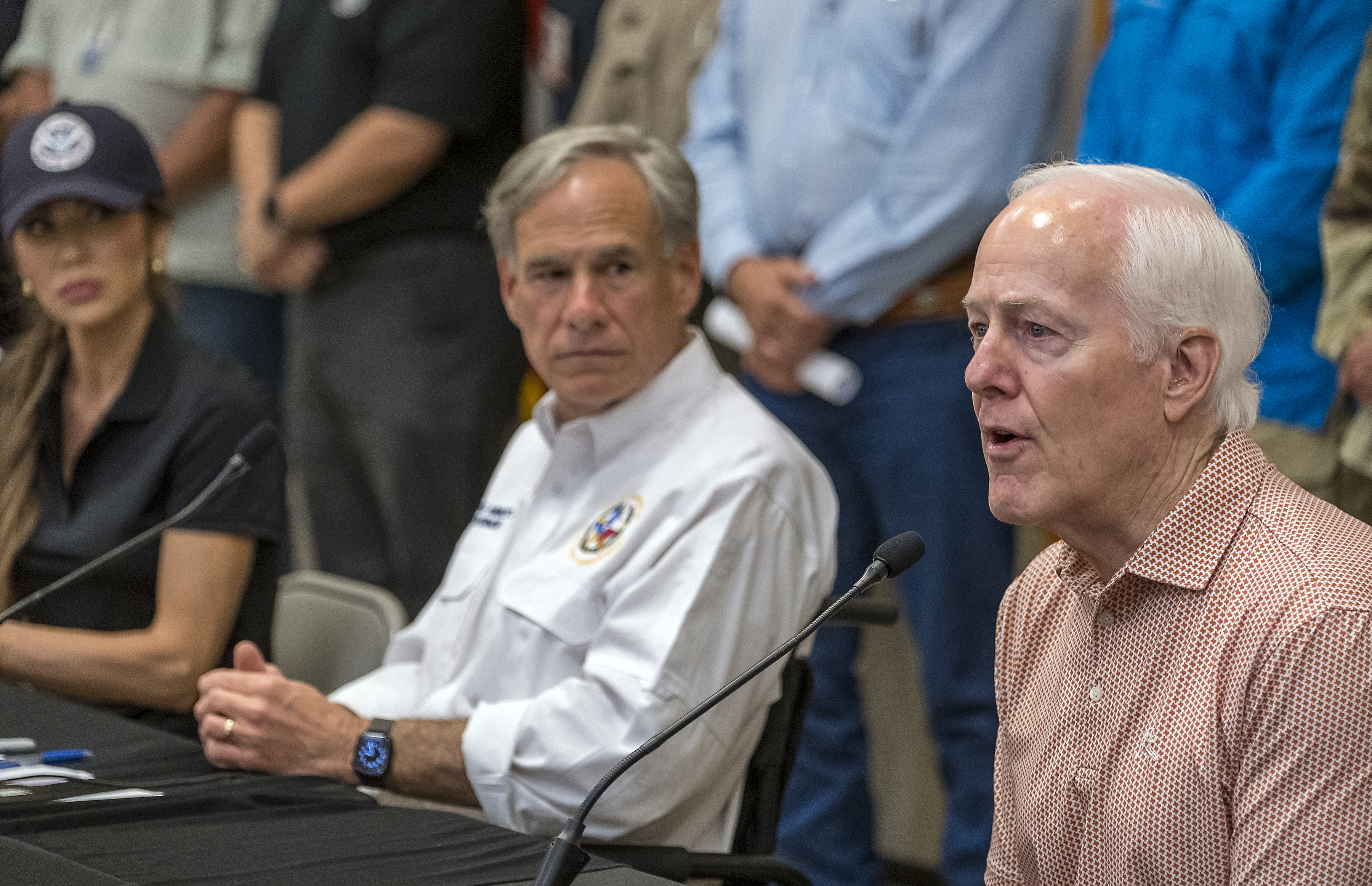 Sen. John Cornyn, right, speaks to media during a press conference as Homeland Security Secretary Kristi Noem, left, and Gov. Greg Abbott, center, listen after recent flooding along the Guadalupe River during a press conference on Saturday, July 5, 2025, in Kerrville, Texas. (AP Photo/Rodolfo Gonzalez)