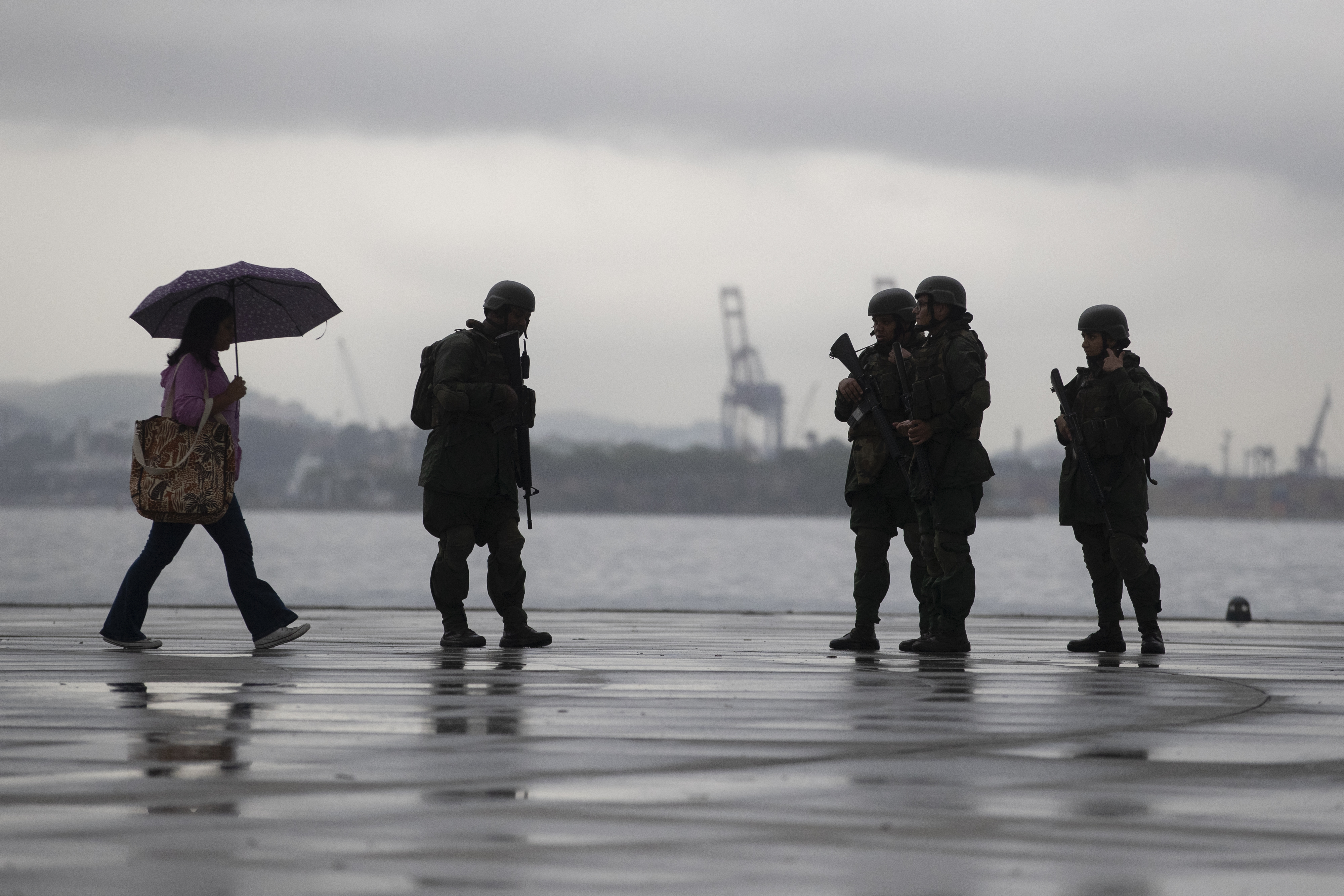 Members of the Brazilian Navy patrol along the Guanabara Bay waterfront, ahead of the upcoming 17th annual BRICS summit, in Rio de Janeiro, Thursday, July 3, 2025. (AP Photo/Bruna Prado)