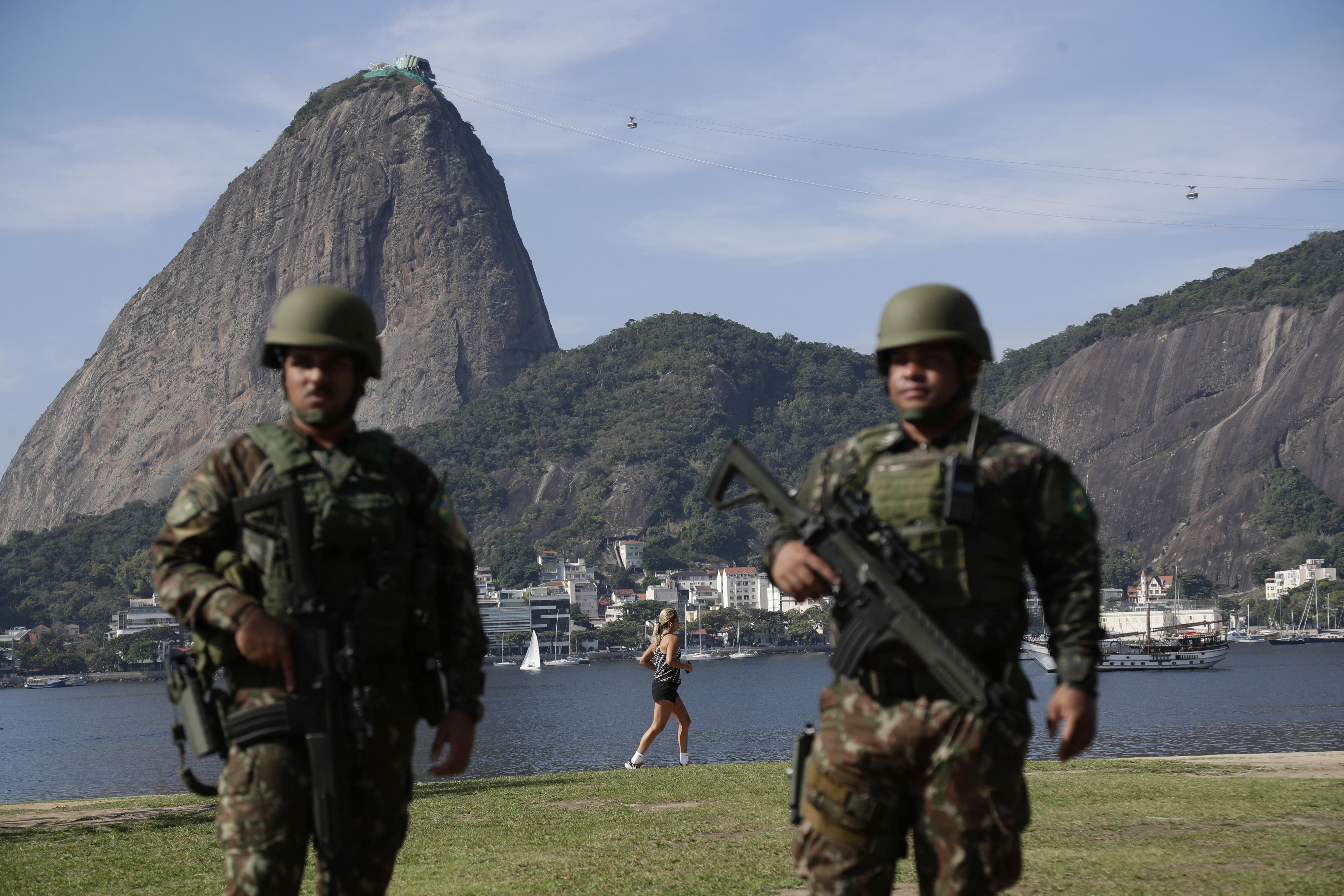 Soldiers patrol Flamengo Beach next to Sugarloaf mountain ahead of the 17th annual BRICS summit in Rio de Janeiro, Sunday, July 6, 2025. (AP Photo/Bruna Prado)