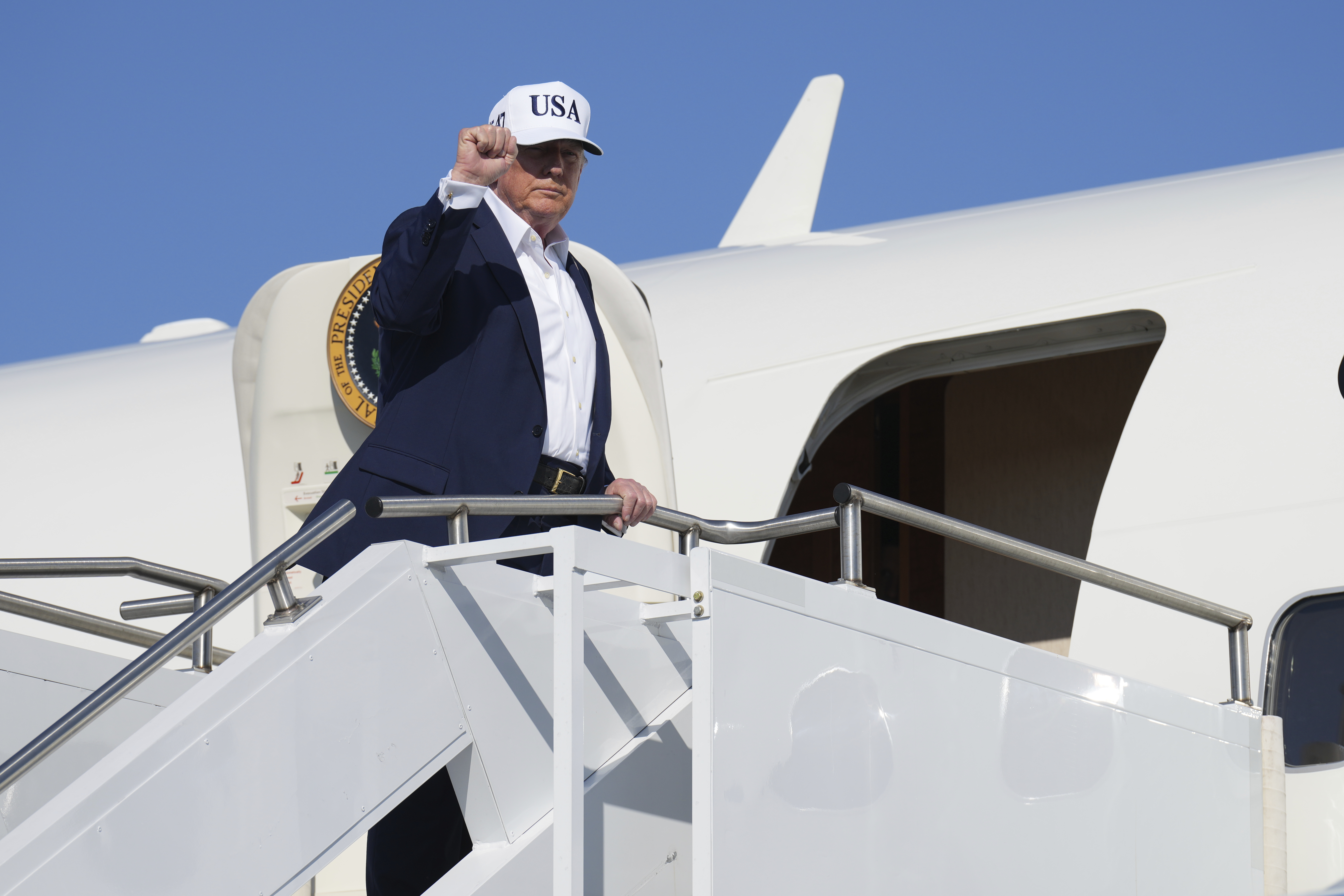 President Donald Trump boards Air Force One at Morristown Municipal Airport in Morristown, N.J., Sunday, July 6, 2025, en route to Washington. (AP Photo/Jacquelyn Martin)
