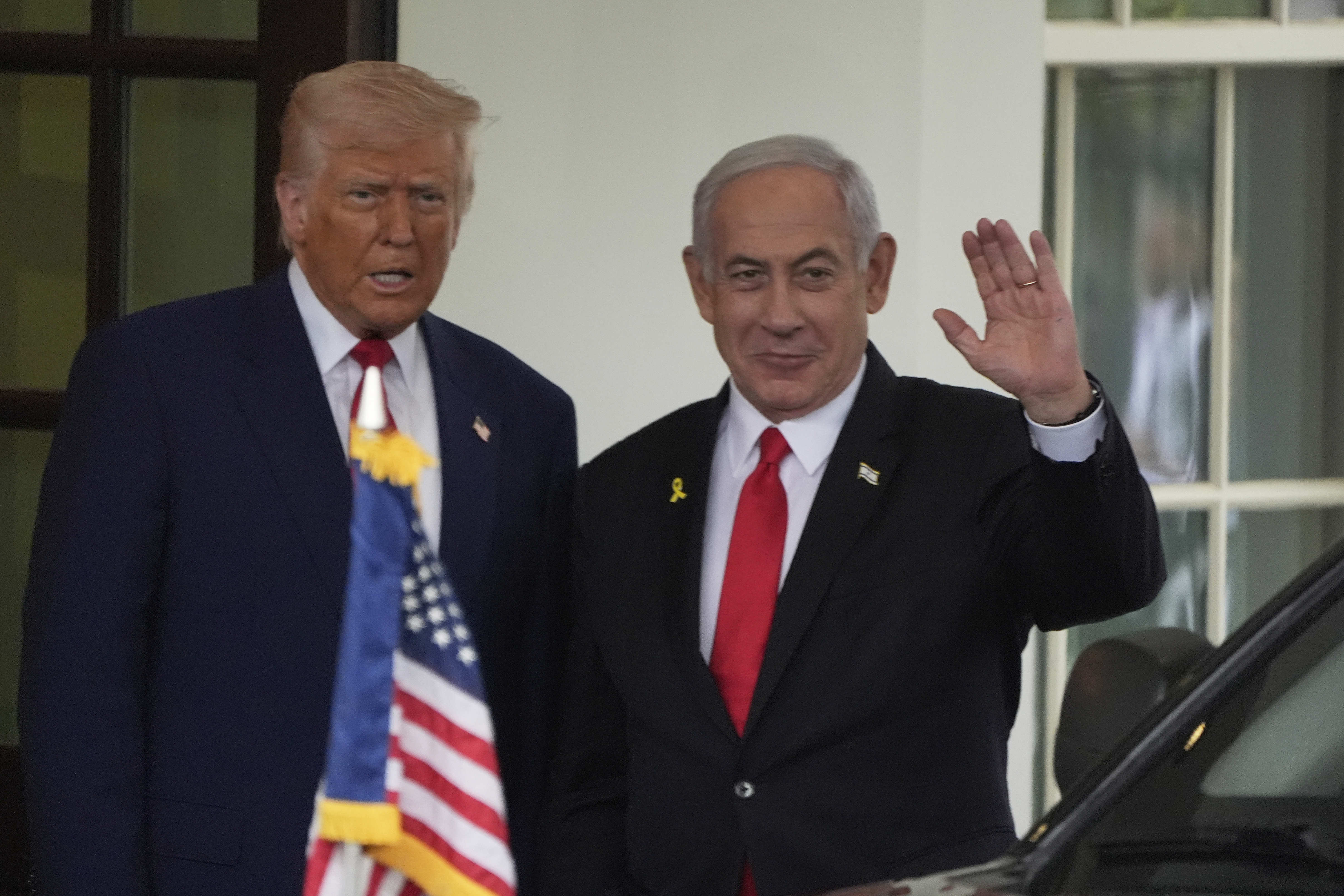FILE - Israel's Prime Minister Benjamin Netanyahu, right, is greeted by President Donald Trump as he arrives at the West Wing of the White House in Washington, April 7, 2025, in Washington. (AP Photo/Mark Schiefelbein, File)