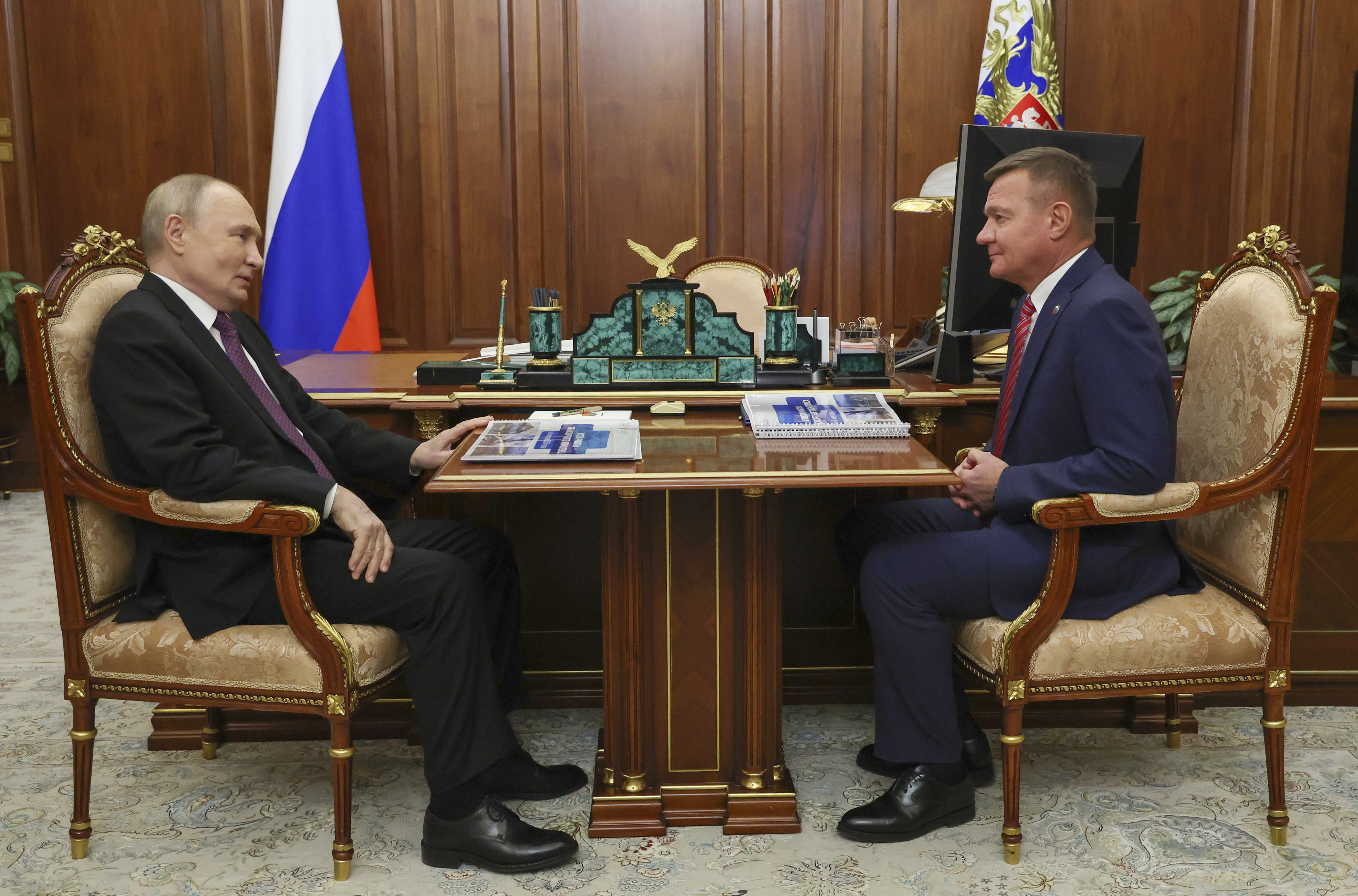 FILE - Russian President Vladimir Putin, left, meets with Russian Transport Minister Roman Starovoyt at the Kremlin in Moscow, Russia, Thursday, Jan. 30, 2025. (Gavriil Grigorov, Sputnik, Kremlin Pool Photo via AP, File)