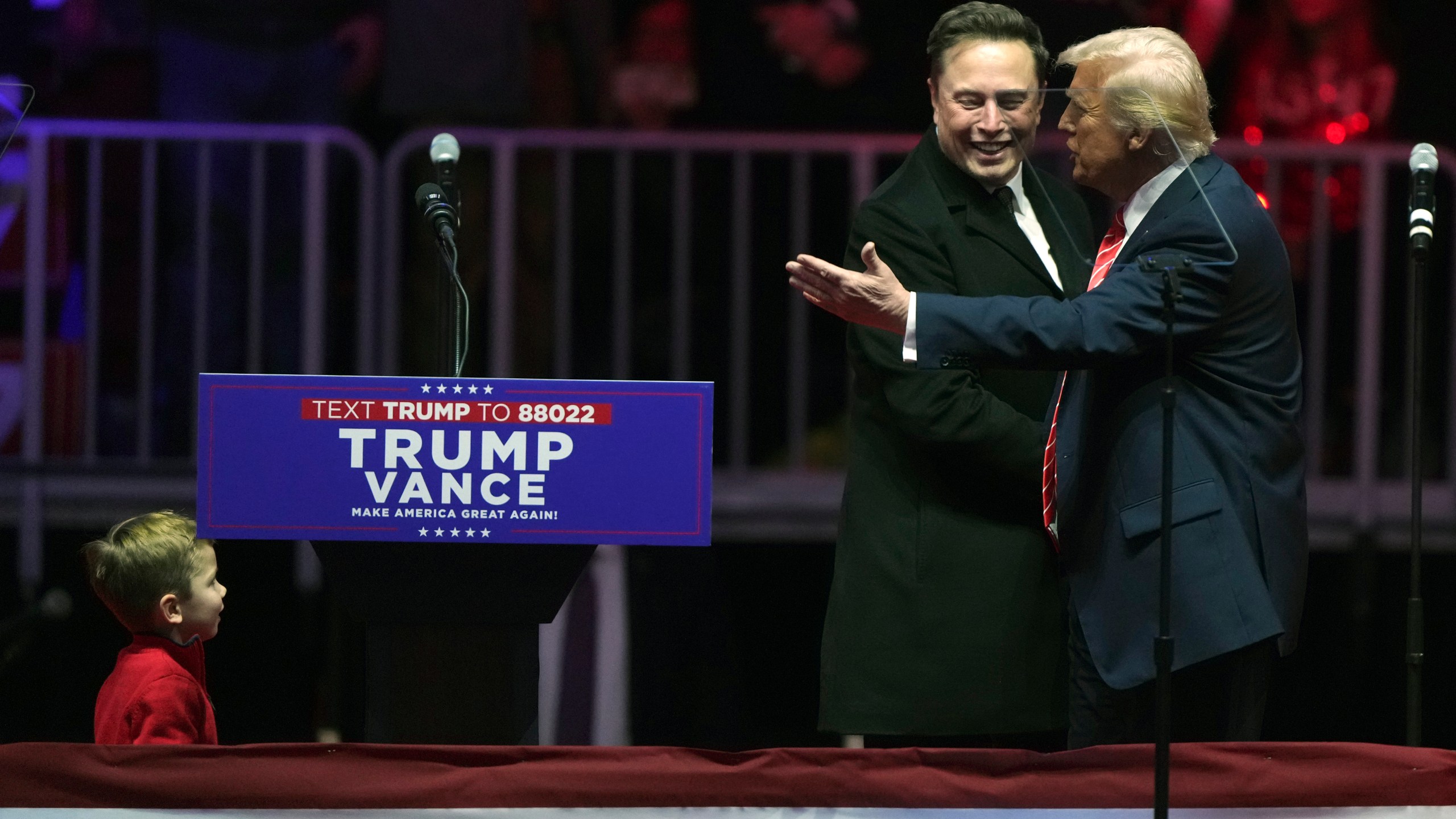 FILE - Elon Musk, with his son X Æ A-Xii, arrives on the dais with President-elect Donald Trump, at a rally ahead of the 60th Presidential Inauguration, Jan. 19, 2025, in Washington. (AP Photo/Matt Rourke, File)