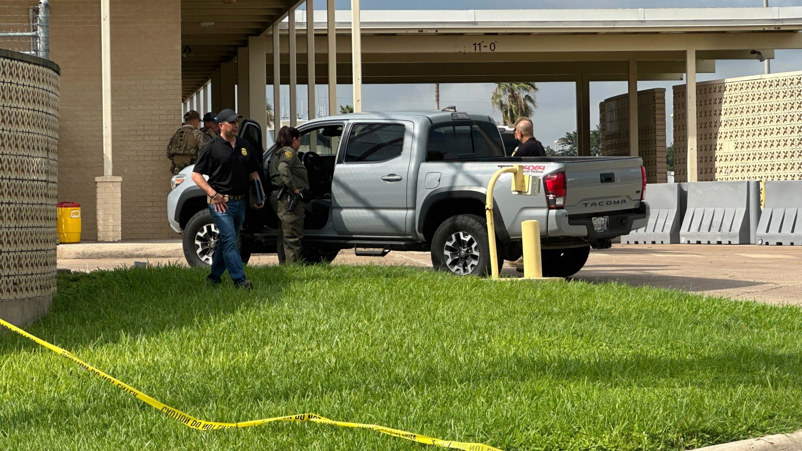 Officials work the scene of a shooting at a Border Patrol facility in McAllen, Texas, Monday, July 7, 2025. (AP Photo/Valerie Gonzalez)