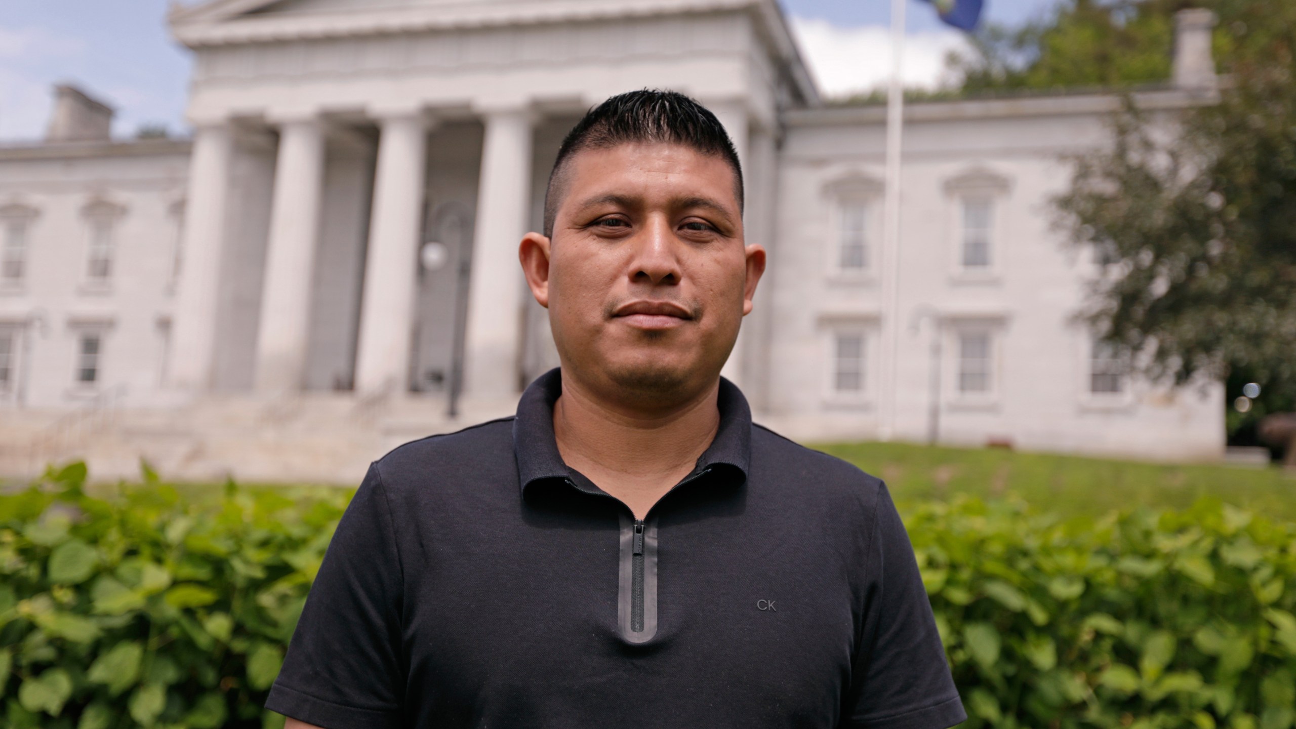 Dairy farmworker José Molina-Aguilar stands outside the Vermont Statehouse after a rally for housing rights for migrant farmworkers in Montpelier, Vt., on Friday, June 13, 2025. (AP Photo/Amanda Swinhart)