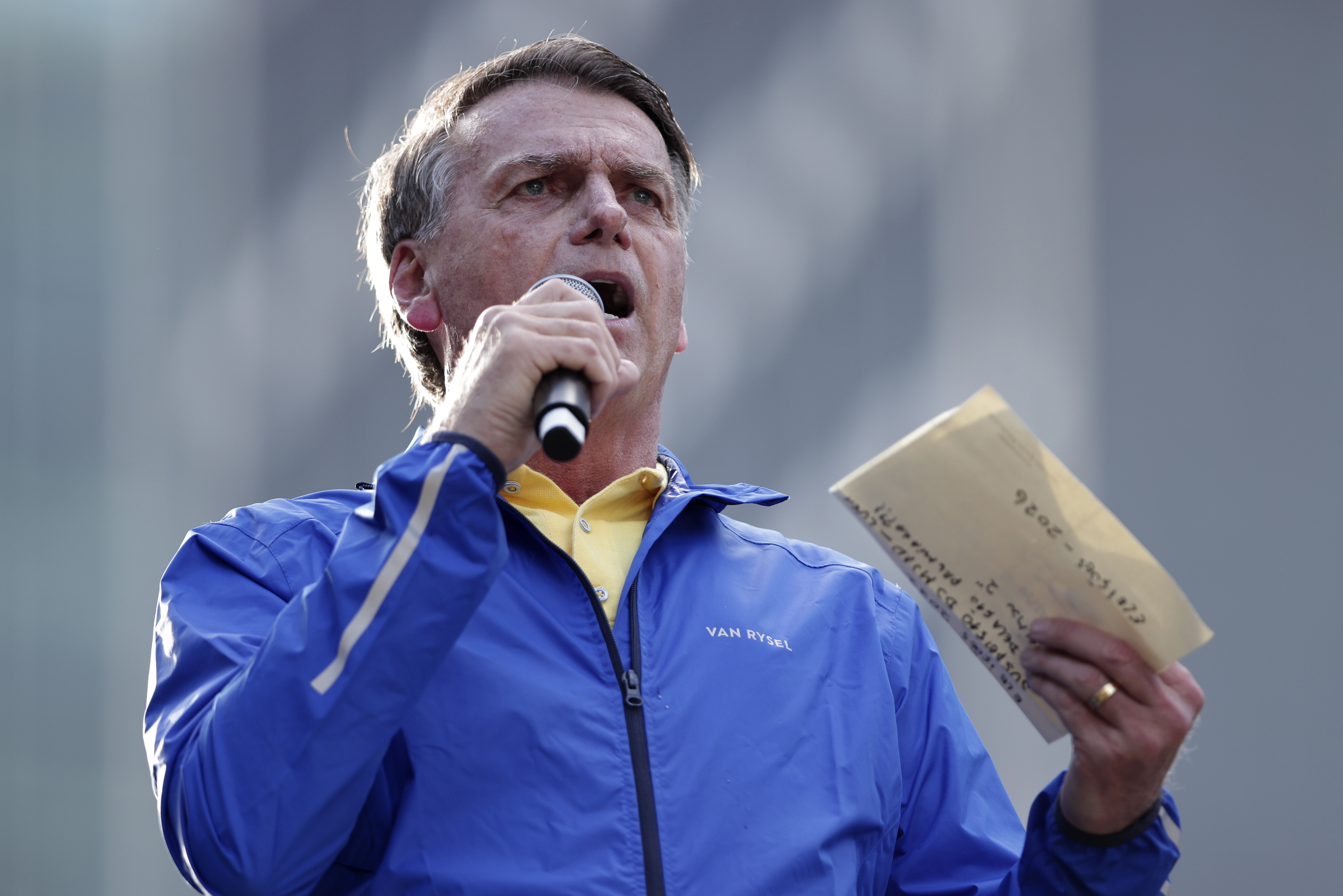 Former President Jair Bolsonaro speaks during a protest against his Supreme Court trial, in which he is accused of involvement in a 2022 coup attempt, in Sao Paulo, Sunday, June, 29, 2025. (AP Photo/Ettore Chiereguini)