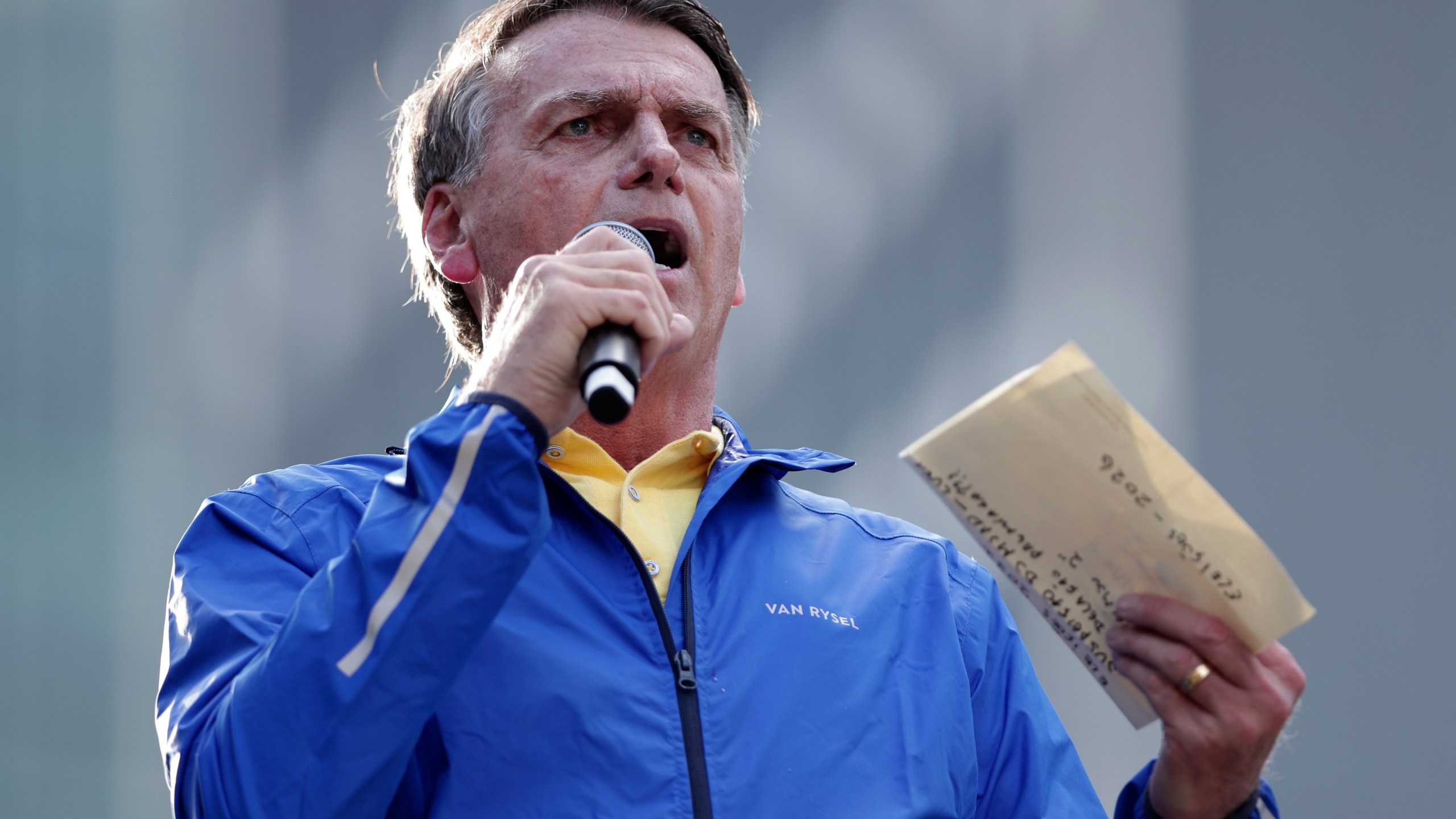 Former President Jair Bolsonaro speaks during a protest against his Supreme Court trial, in which he is accused of involvement in a 2022 coup attempt, in Sao Paulo, Sunday, June, 29, 2025. (AP Photo/Ettore Chiereguini)