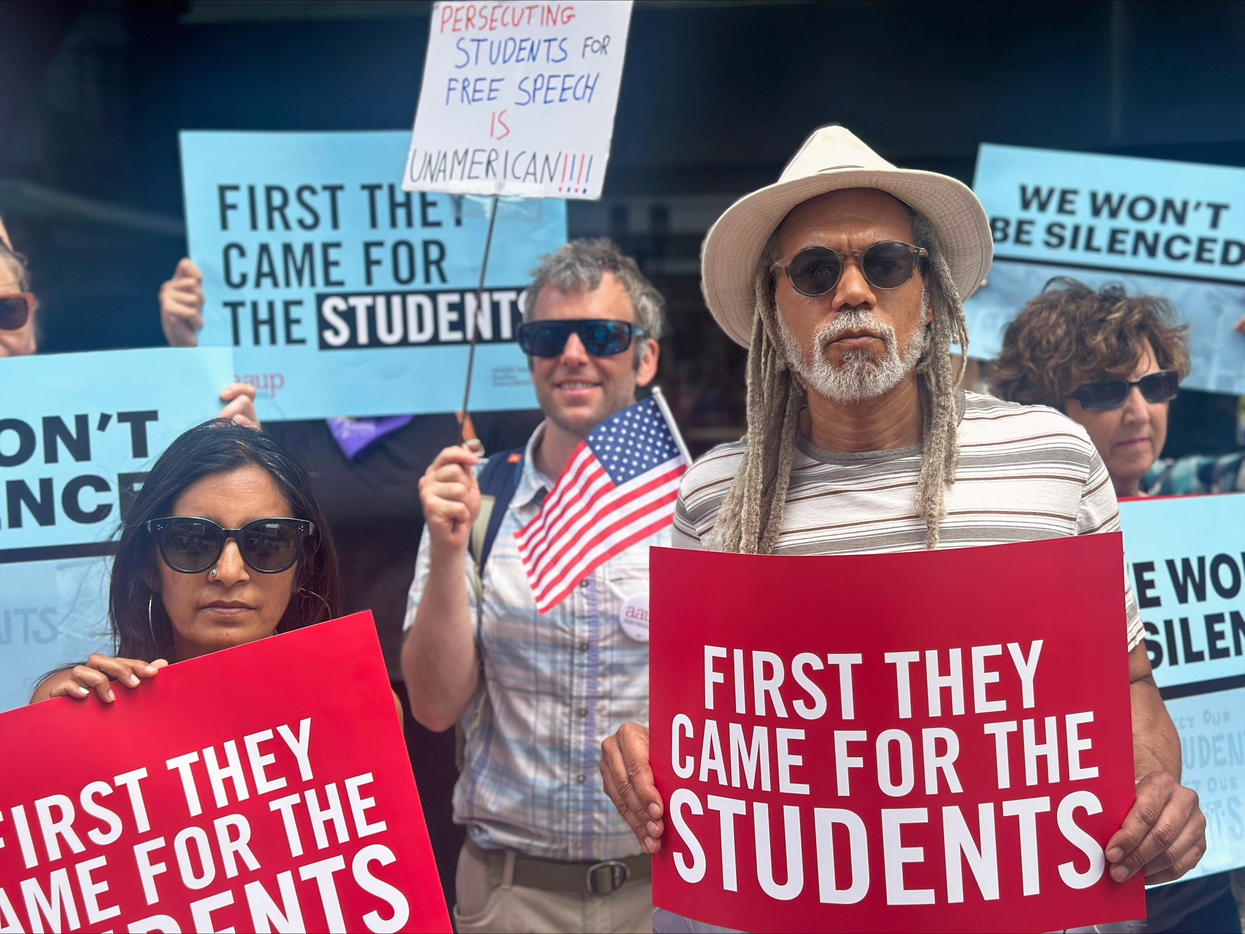 People show their support for a lawsuit challenging the Trump administration's policy of targeting students for deportation who took part in pro-Palestinian demonstrations on Monday, July 7, 2025, at the federal courthouse in Boston. (AP Photo/Michael Casey)