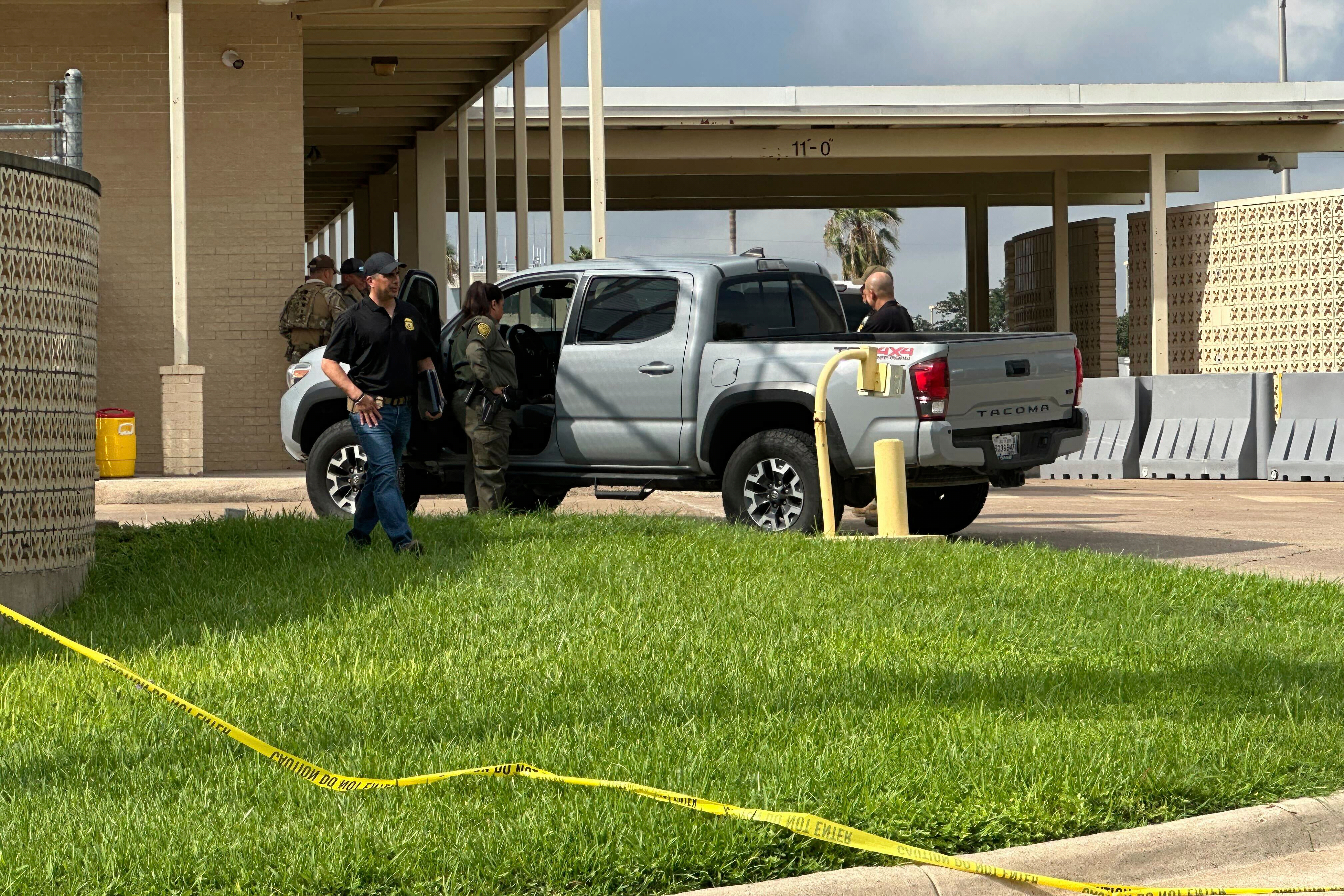 Officials work the scene of a shooting at a Border Patrol facility in McAllen, Texas, Monday, July 7, 2025. (AP Photo/Valerie Gonzalez)