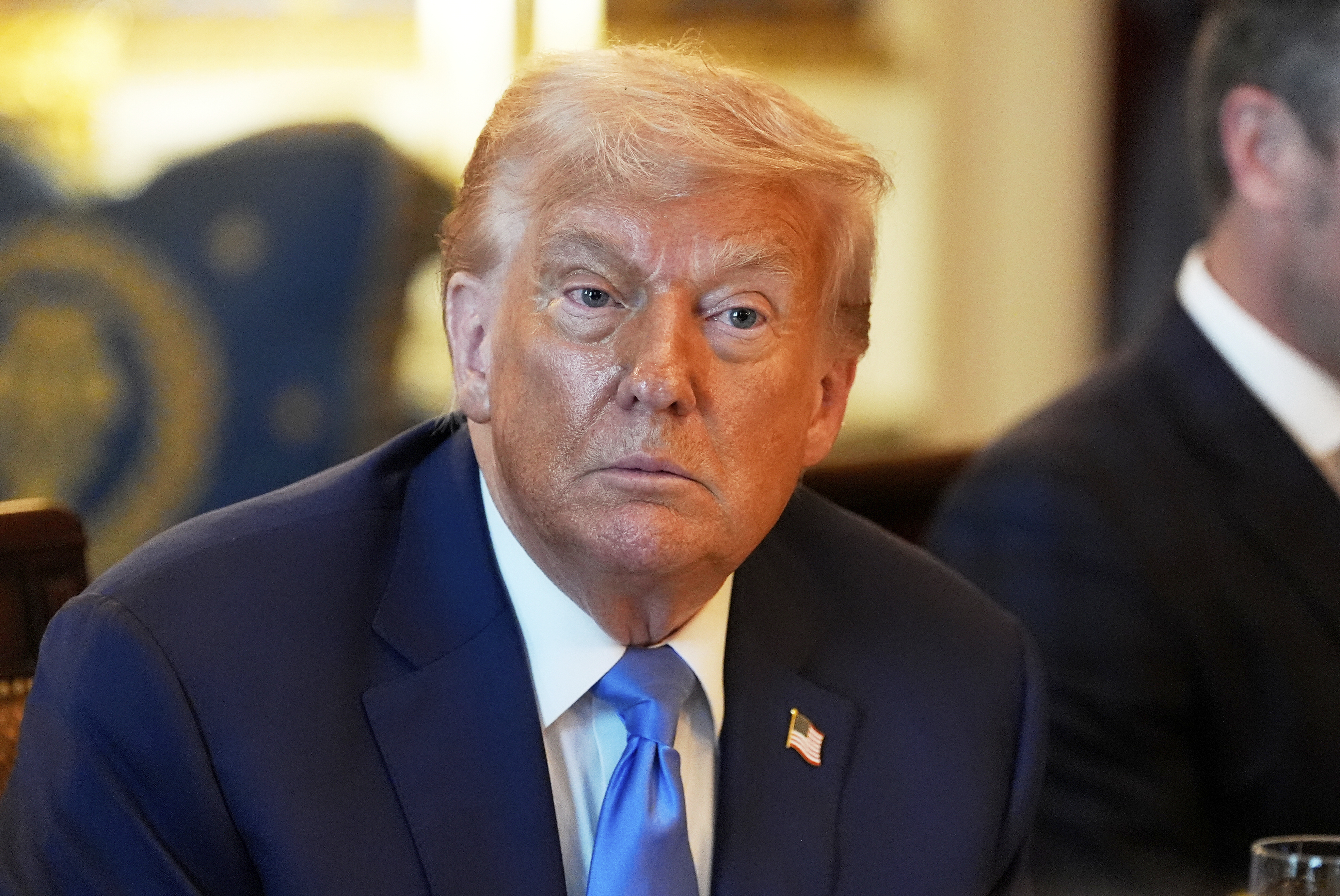 President Donald Trump listens during a meeting with Israel's Prime Minister Benjamin Netanyahu in the Blue Room of the White House, Monday, July 7, 2025, in Washington. (AP Photo/Alex Brandon)