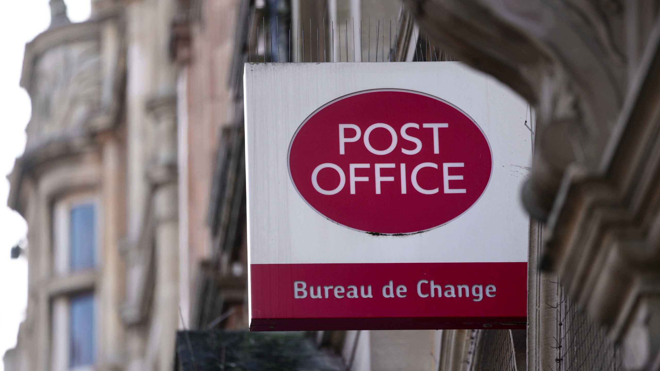 FILE - A logo of a post office is displayed in London, Wednesday, Jan. 10, 2024. (AP Photo/Kin Cheung, File)