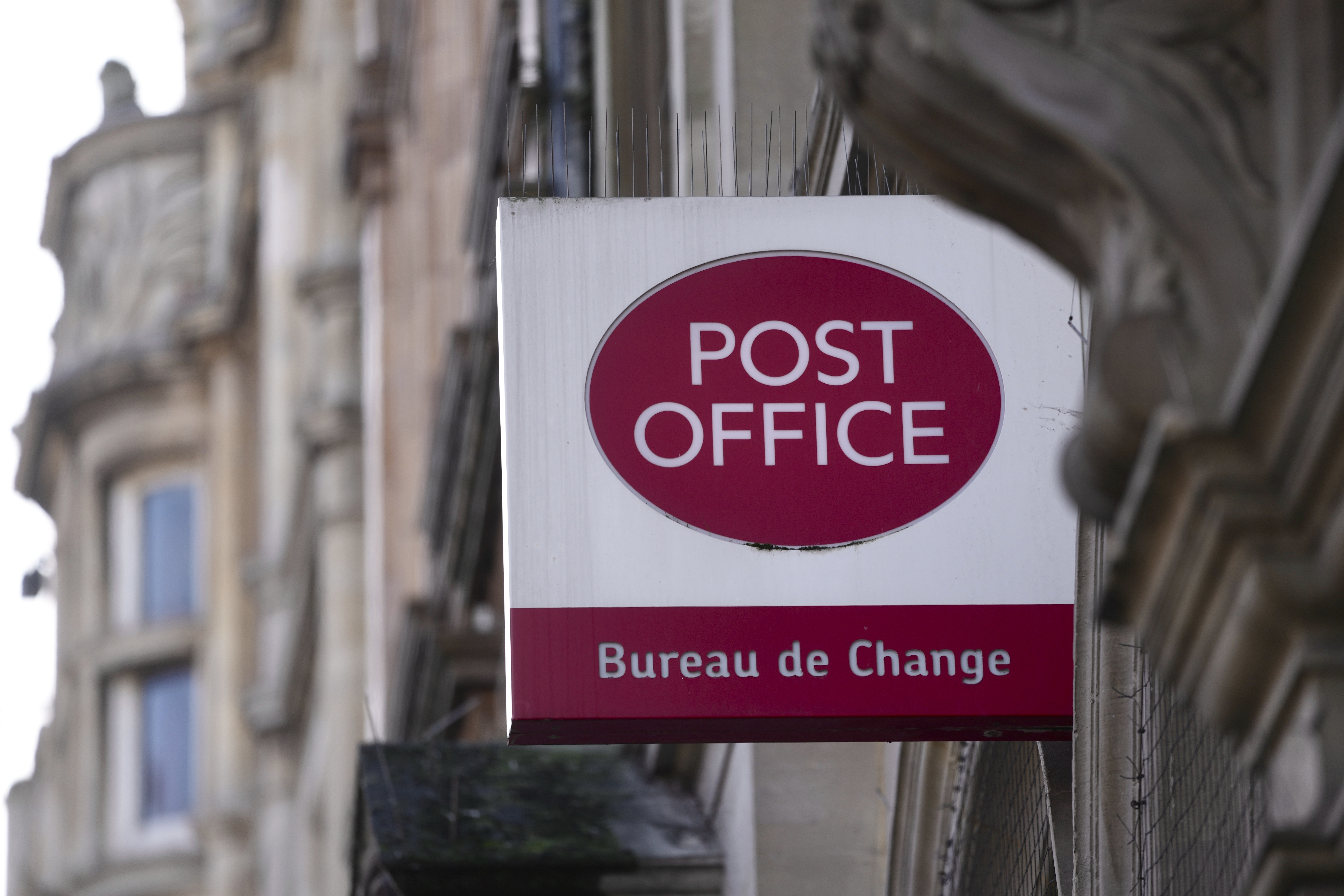 FILE - A logo of a post office is displayed in London, Wednesday, Jan. 10, 2024. (AP Photo/Kin Cheung, File)
